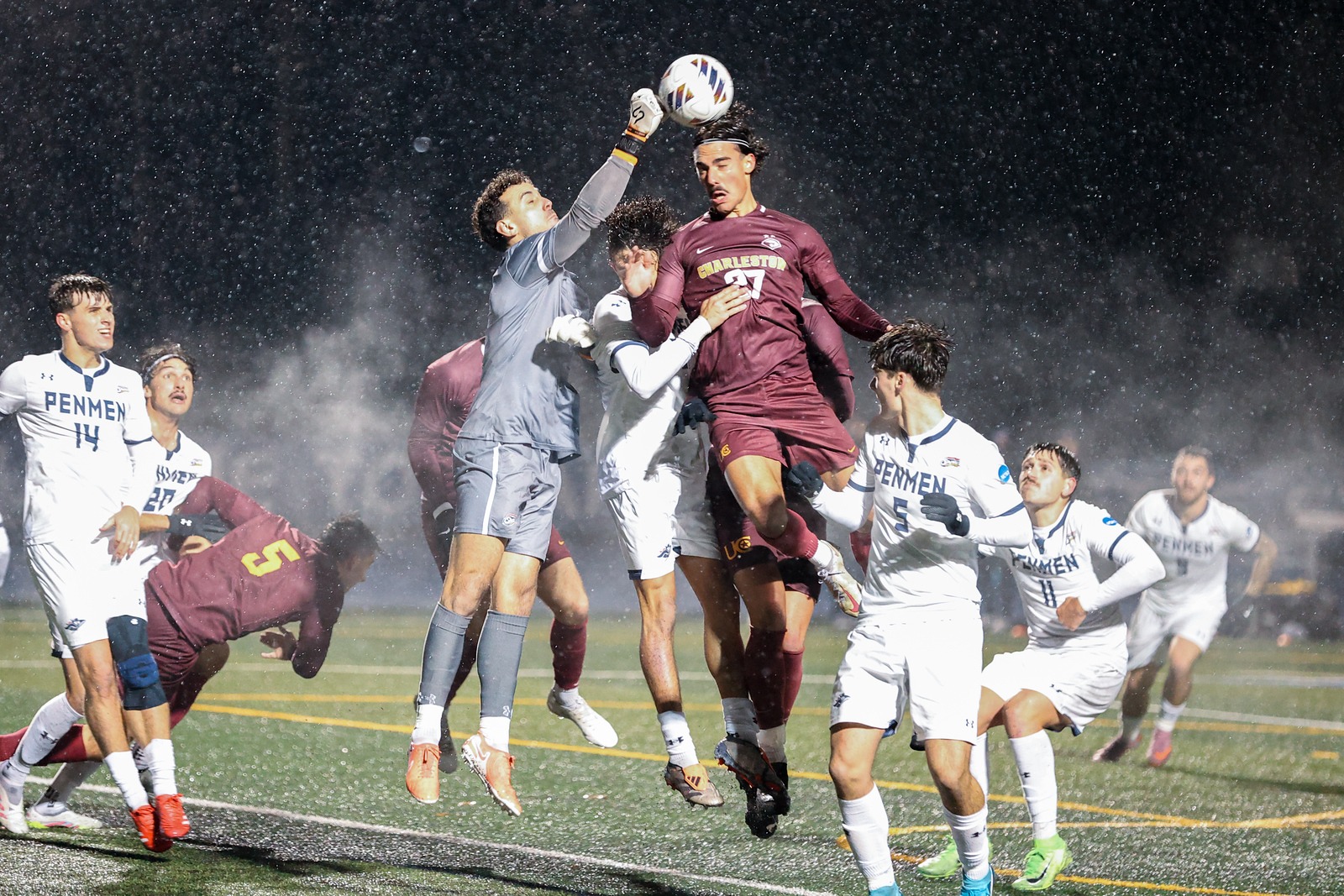 Joao Silva header in the rain