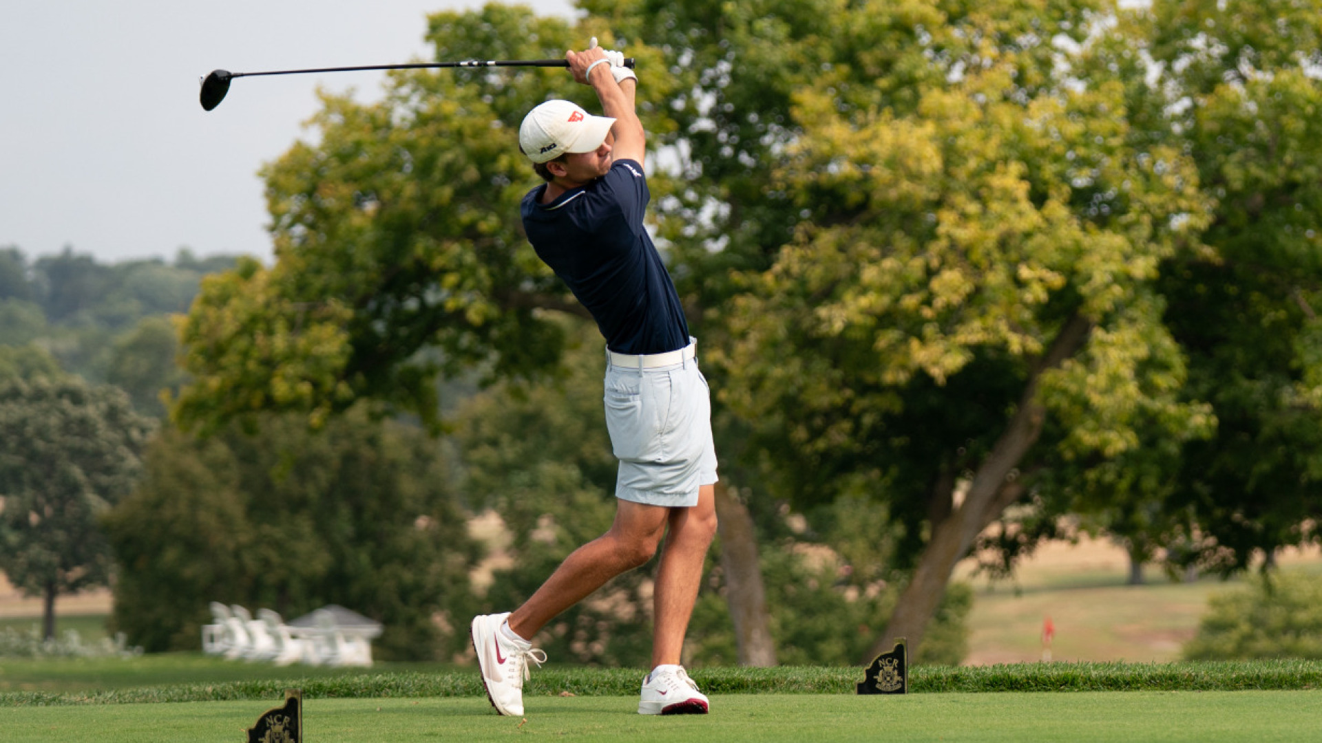 Men's golfer Luke Kahle in his backswing in a tee box at Dayton Country Club