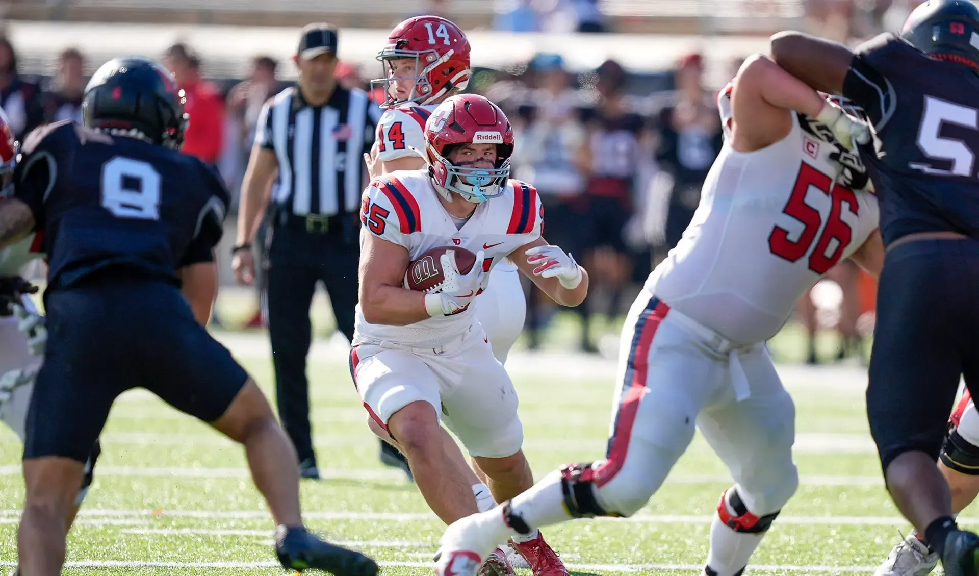 Luke Hansen carries the ball up the middle against Davidson