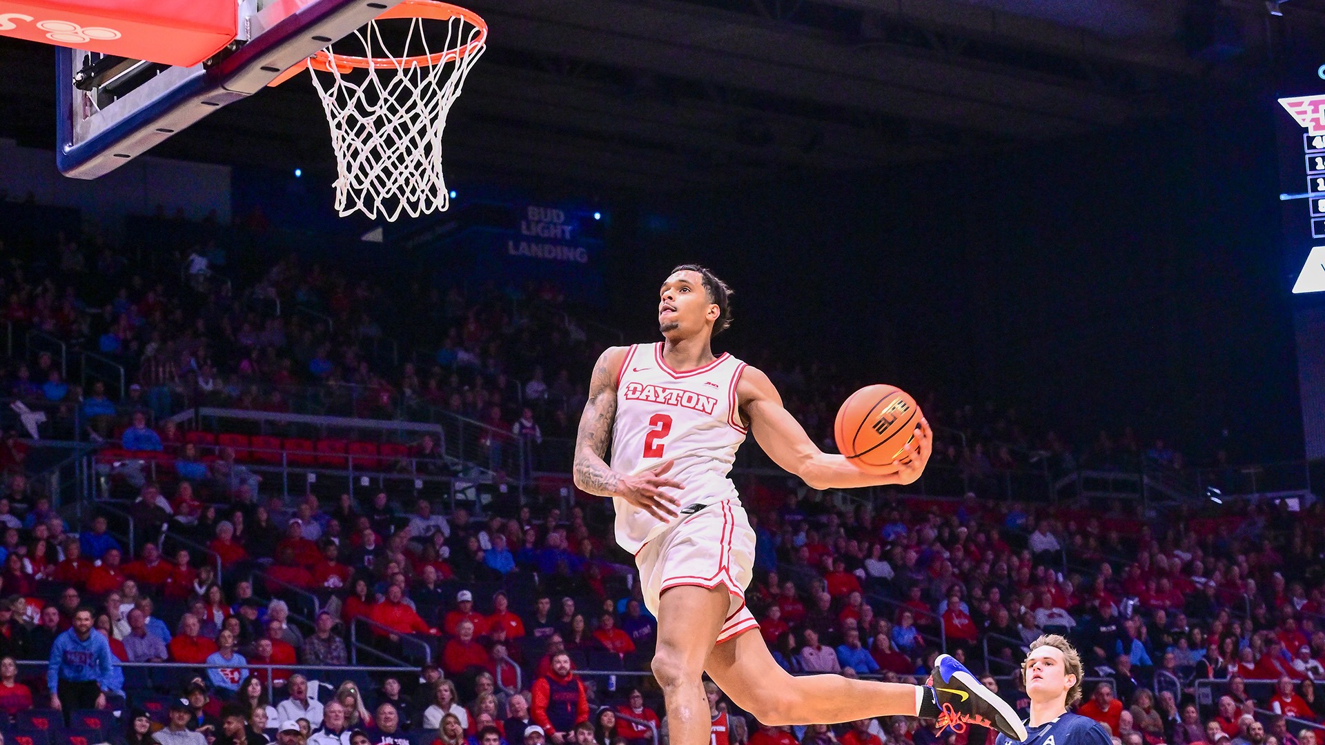 Dayton men's basketball player De'Shayne Montgomery goes up for a windmill dunk against North Florida.