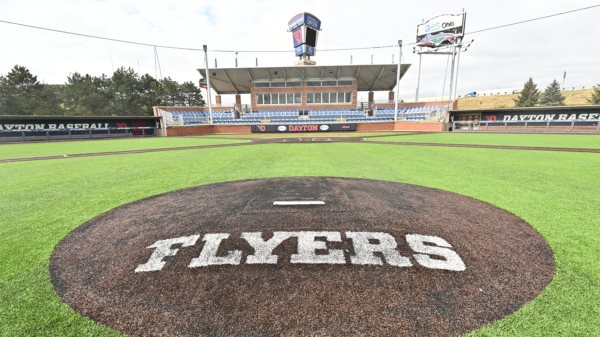 A view of Woerner Field at AES Ohio Stadium from the pitcher's mound. The mound says Flyers and the seating area is visible.