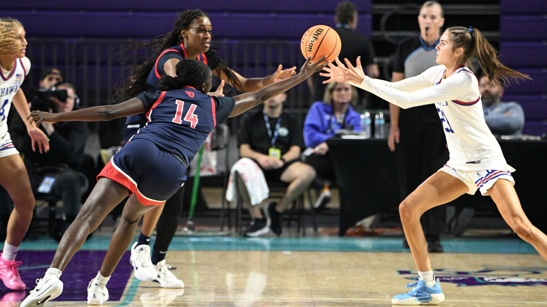 Players going for a loose ball