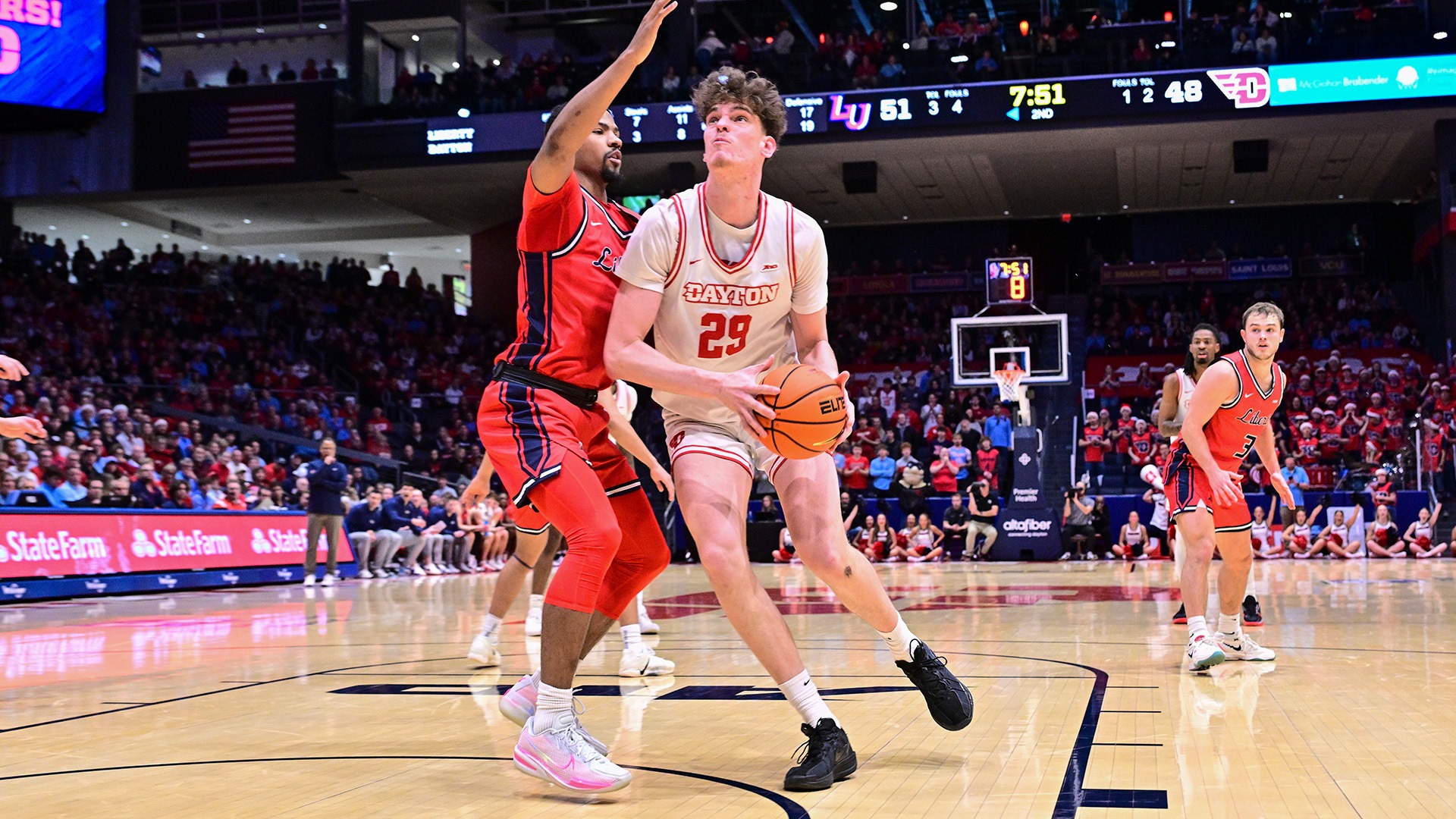 Dayton men's basketball forward Amael L'Etang goes up for a shot against Liberty at UD Arena.