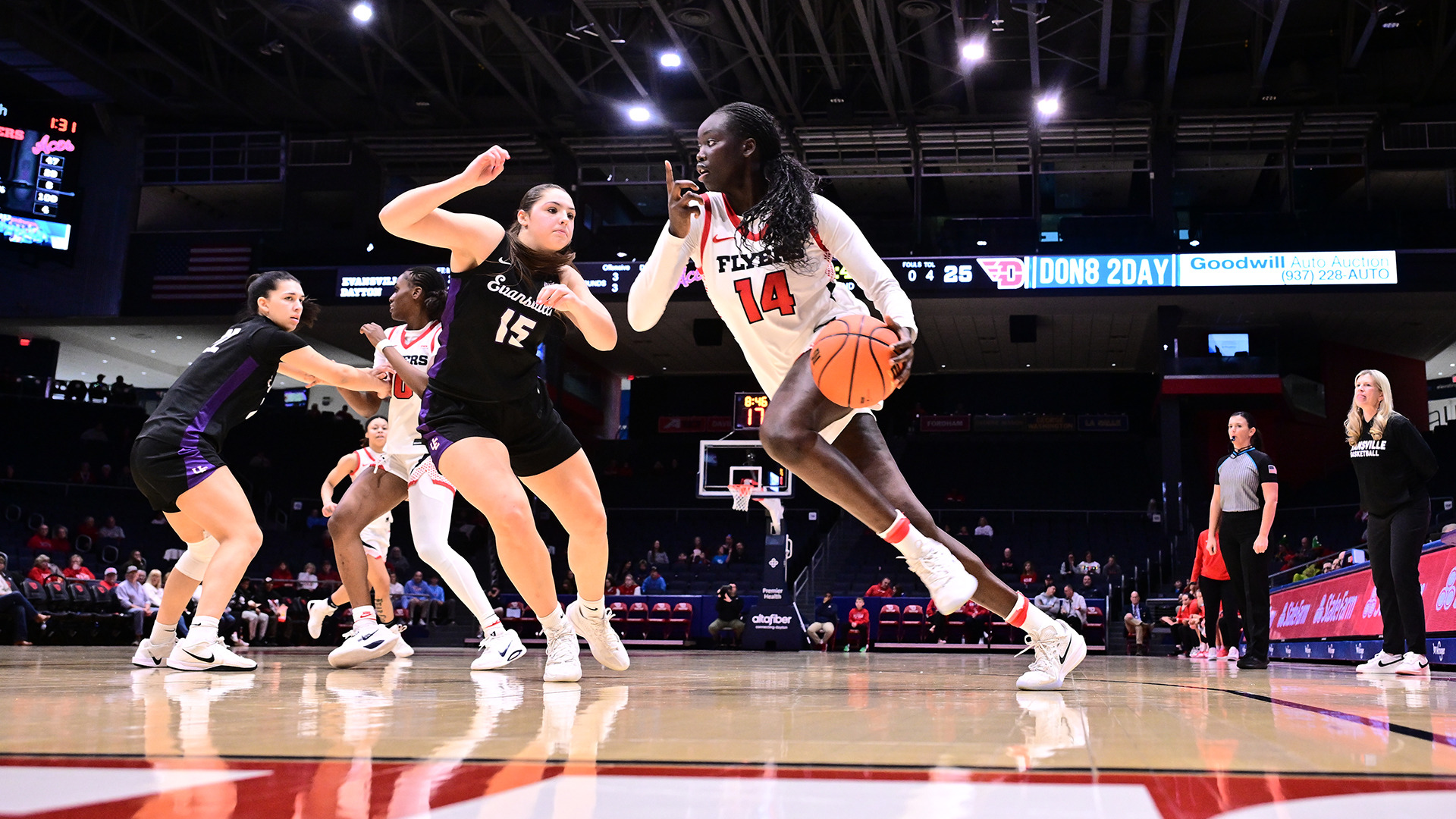 Ajok Madol driving past a defender