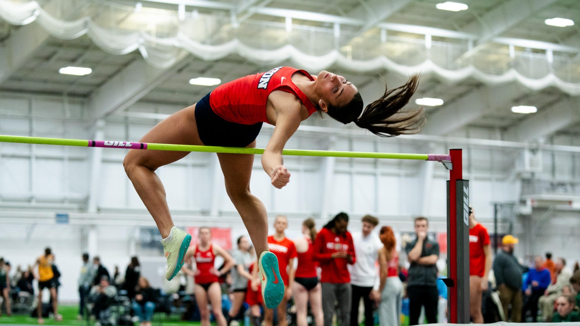 Evelyn Albers jumps over the high jump bar