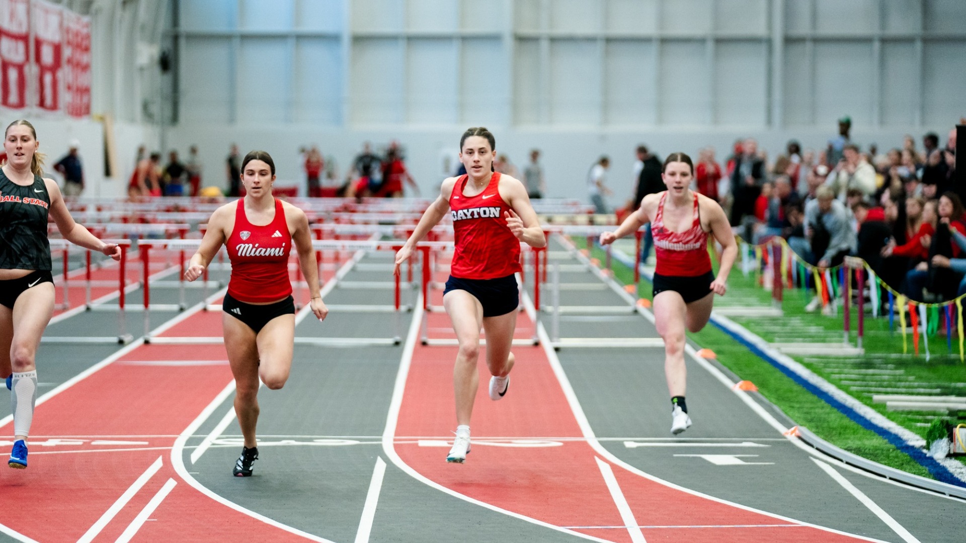 Mia Malito crosses the finish line in a sprints event