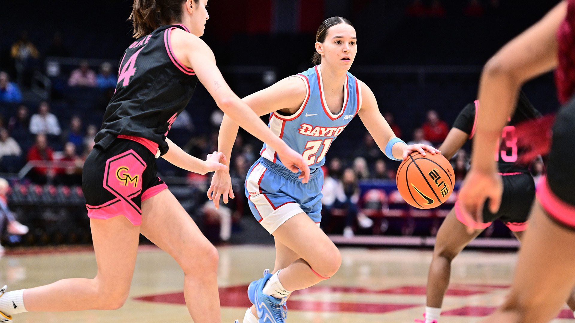 Nicole Stephens dribbling to the basket