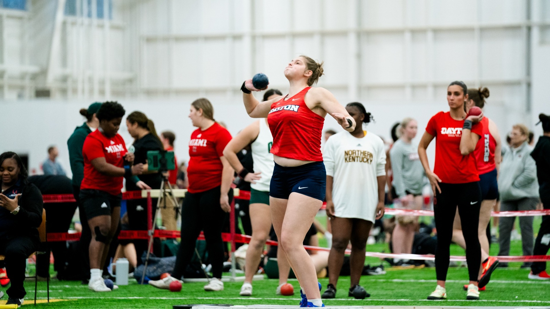 Anna Yater winds up to throw shout put at the Gem City Invitational