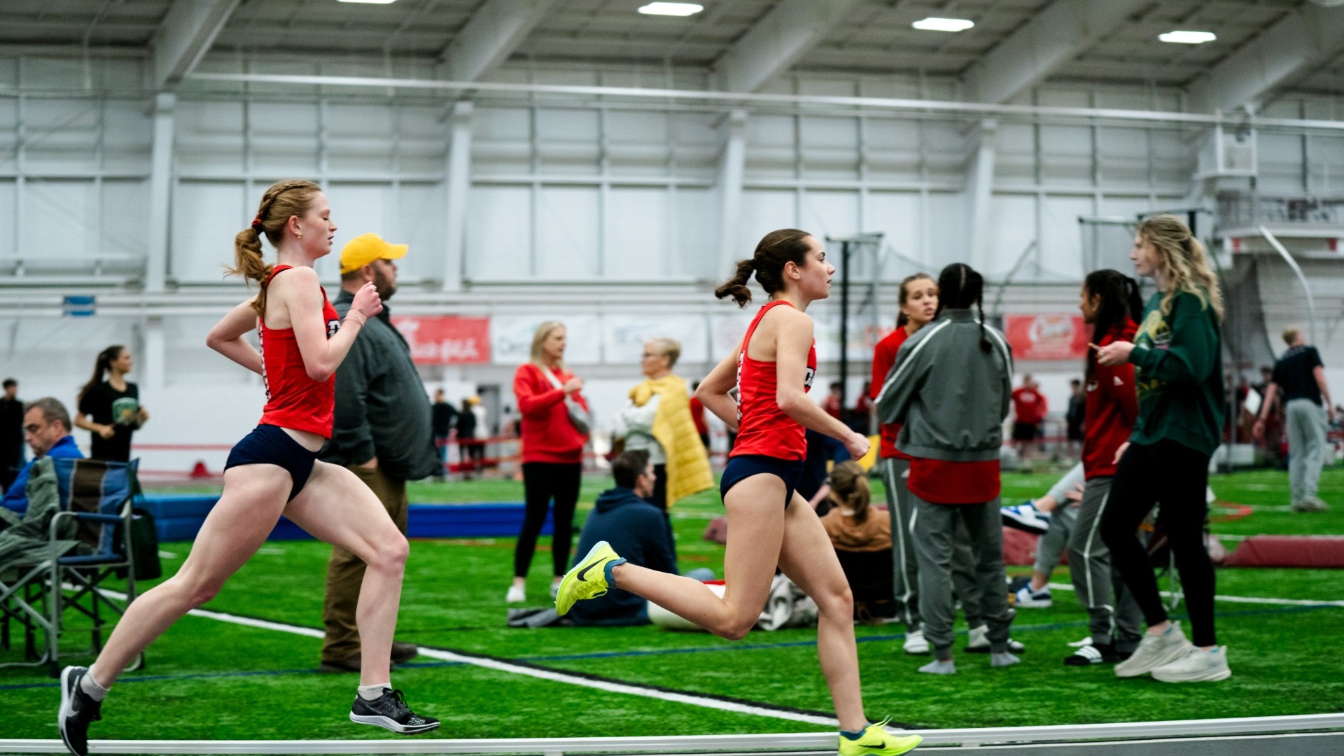 Marissa Pritchett runs just ahead of Bryn Hothem at the Gem City Invitational