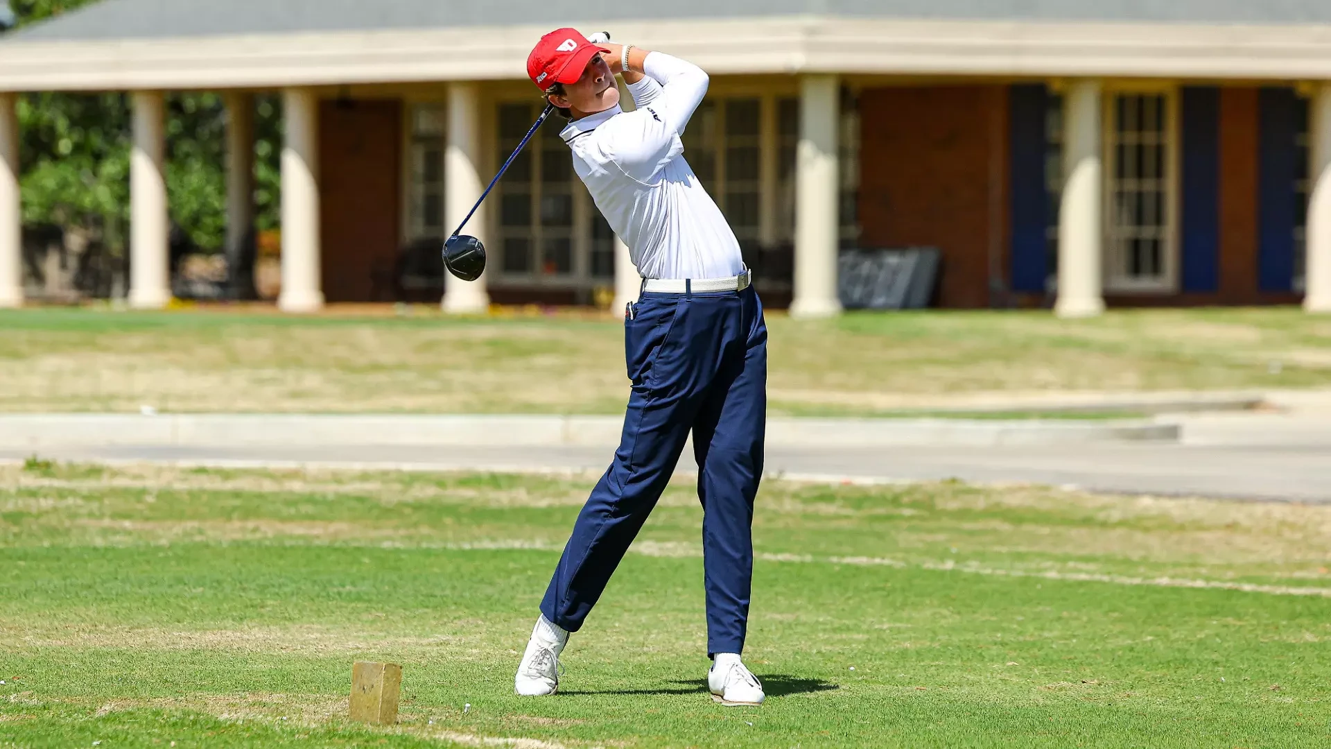 Men's golfer Victor Caliguri in his back swing on a tee box at Colonial Country Club in Cordova, Tenn.