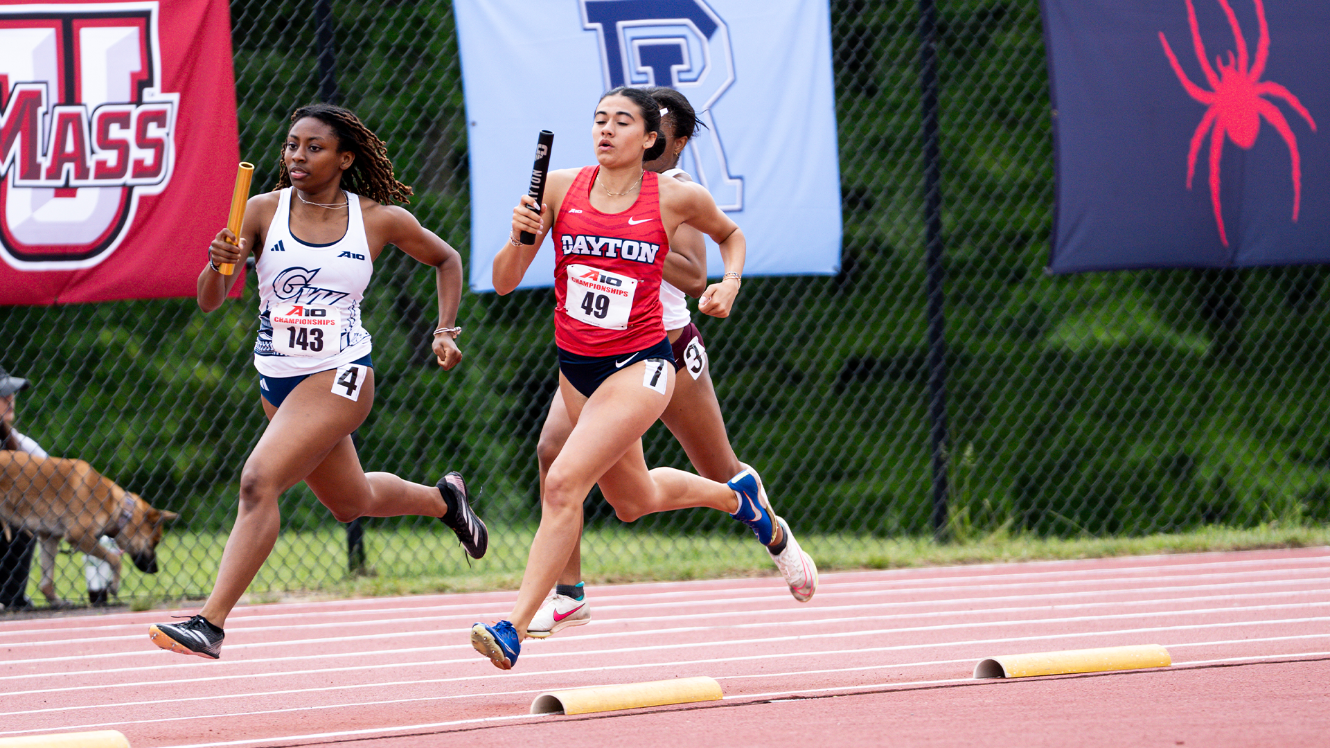 Sydney Workman runs with the baton in the 4x100 at the Atlantic 10 Outdoor Championships