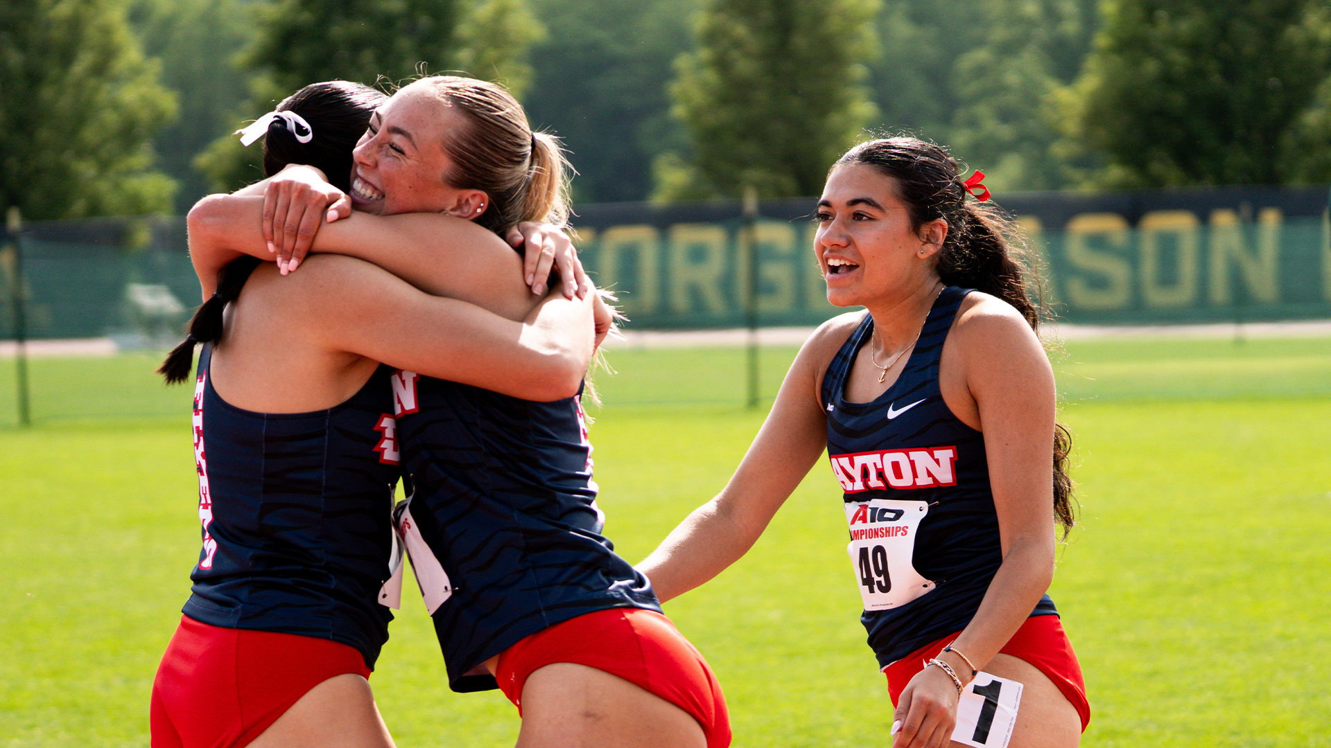 Sydney Workman and Charlotte Deines celebrate a PR after running the 200 at the A-10 Outdoor Track And Field Championships