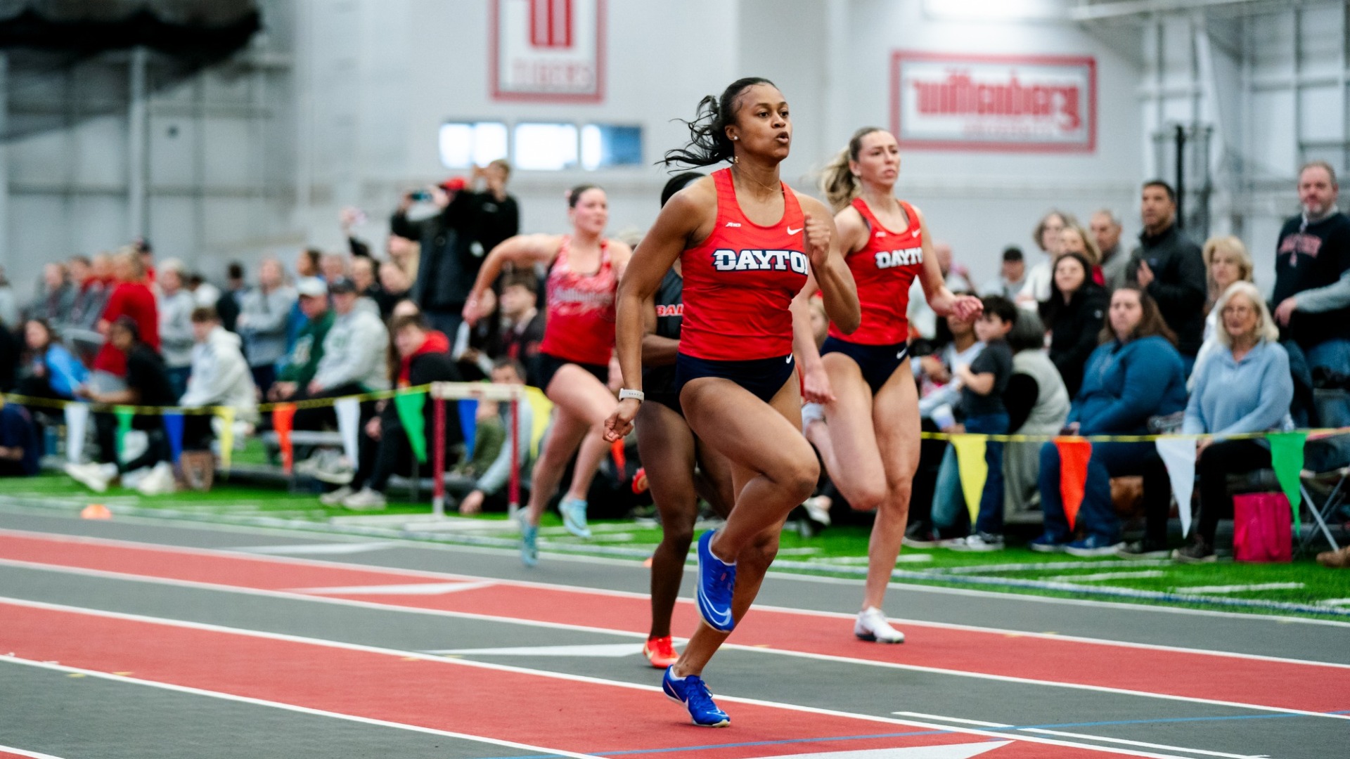 Jadyn Haywood sprints the straightaway in an indoor track race