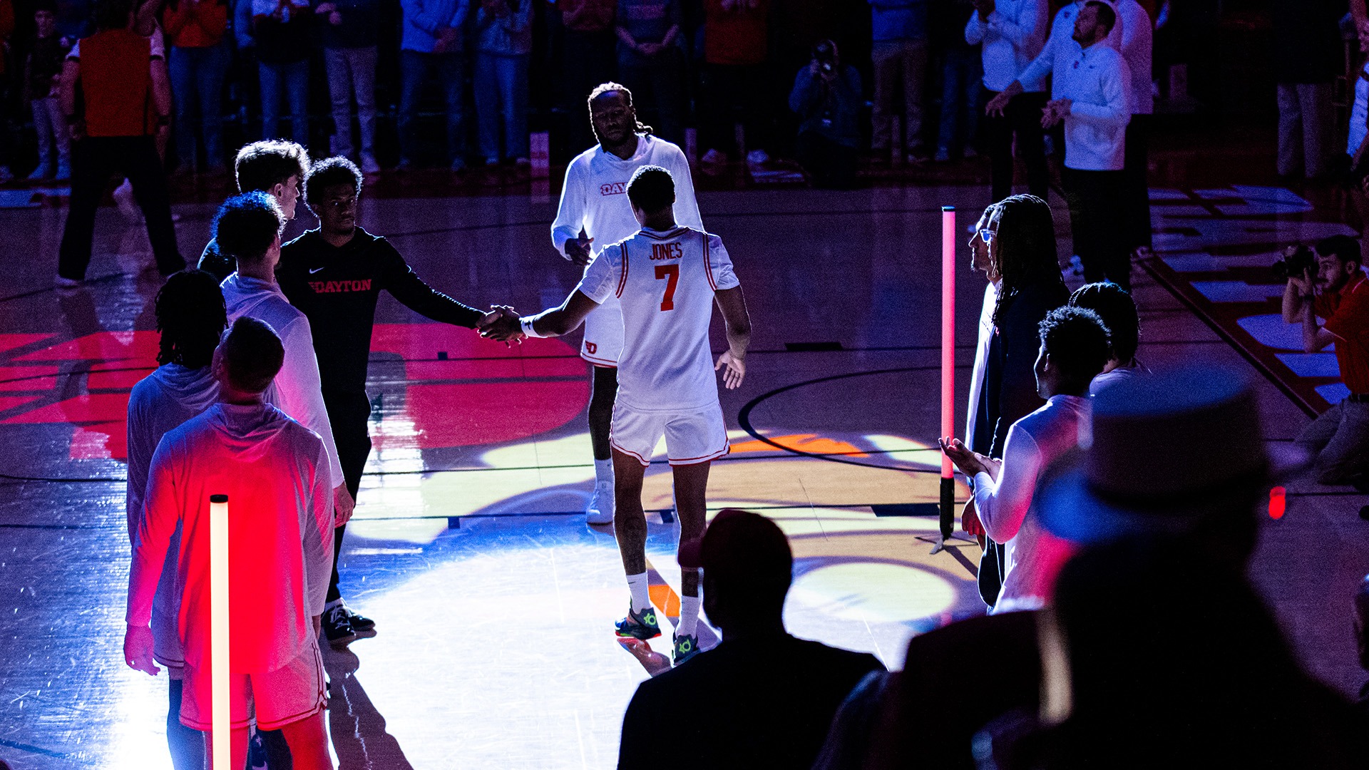 Dayton men's basketball player Keonte Jones walks through the player tunnel in front of the Flyer bench during team introductions.