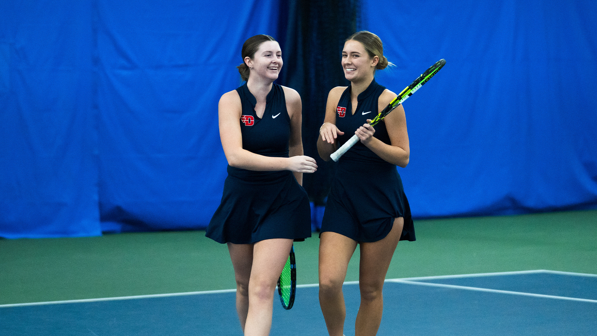 Baby Jordan and Mallory Hitchcock celebrate after a point against EKU.