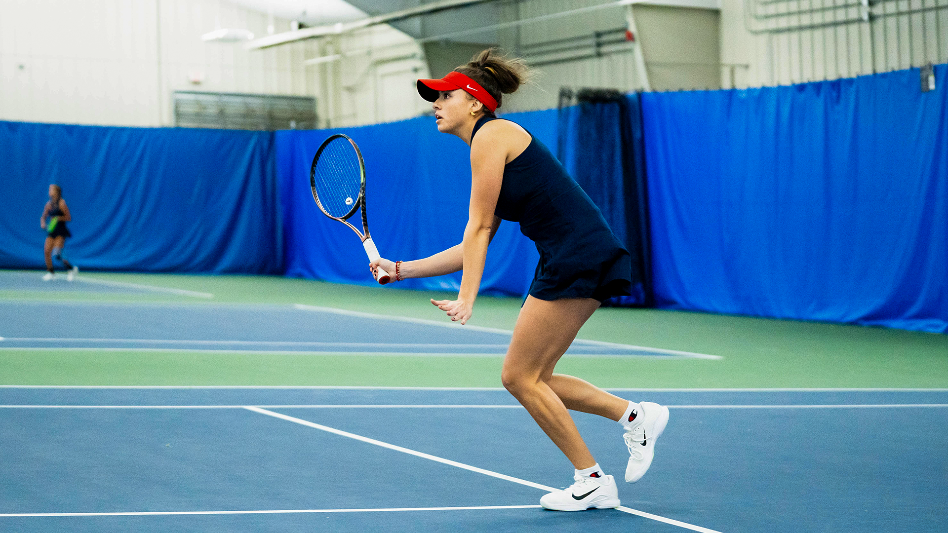 Montserrat Sierra stands ready to receive the ball.