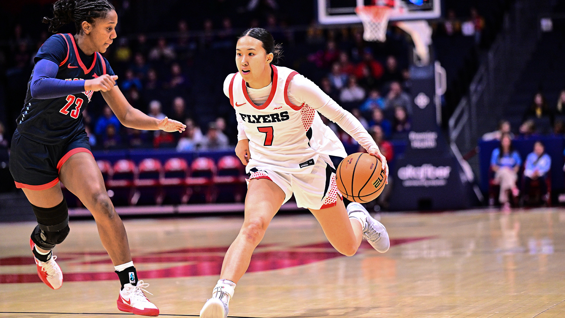 Olivia Leung driving past the defender