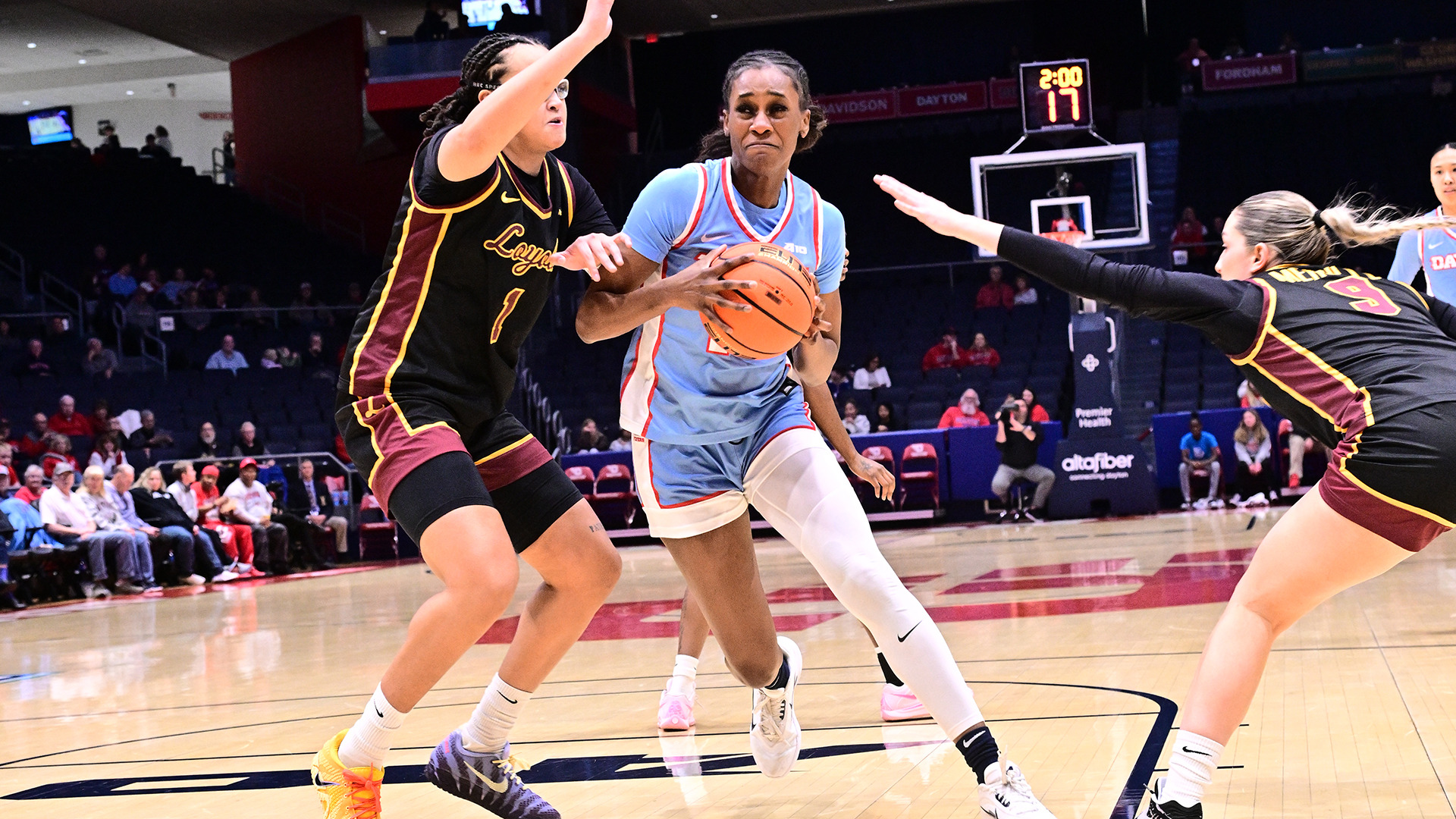 Fatima Ibrahim driving past the defender. 