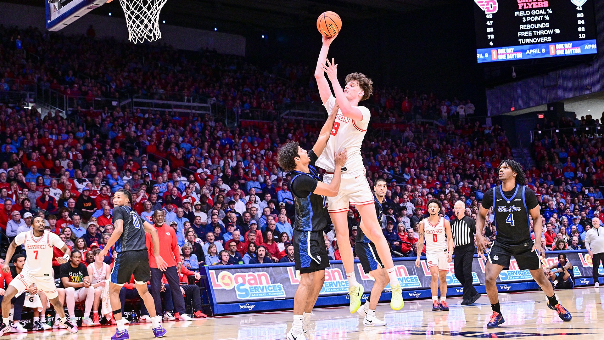 Dayton men's basketball player Amael L'Etang goes up for a mid-range shot against Saint Louis.