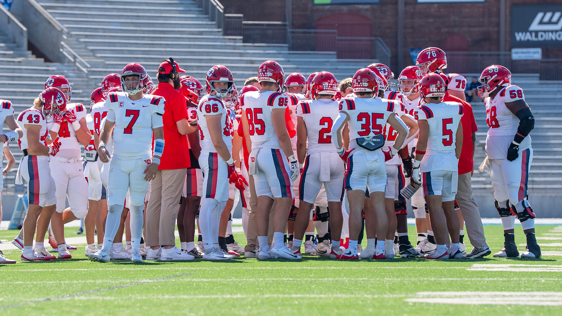 The football team huddling before the game