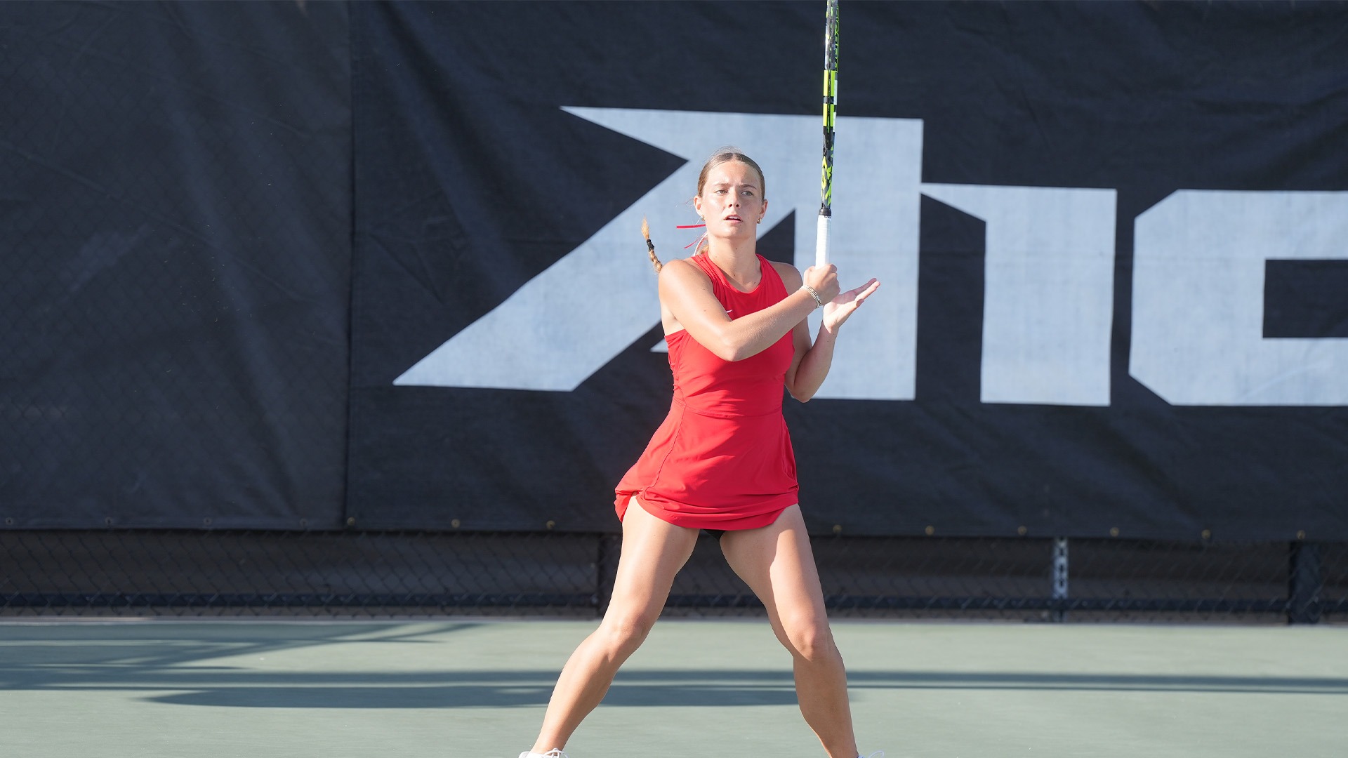 Mallory Hitchcock follows through with her racquet.