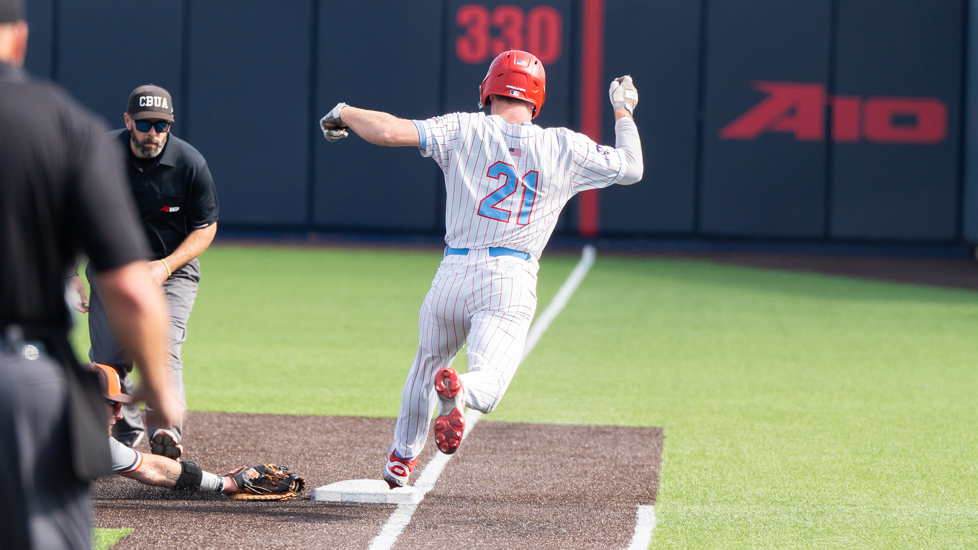 Danny MacDougall beats the first baseman to the base.