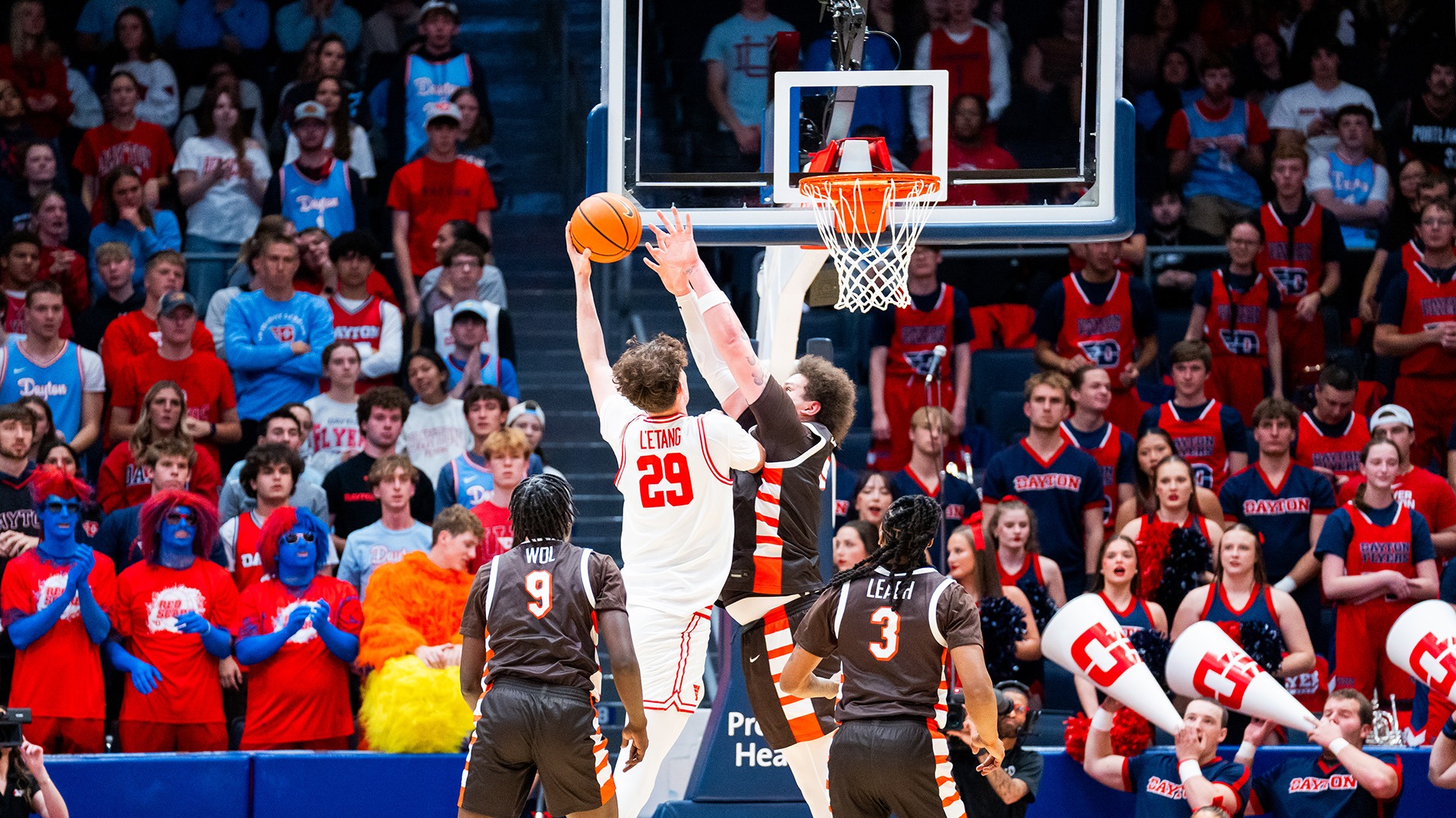 Dayton men's basketball player Amael L'Etang finishes a layup against Bowling Green.