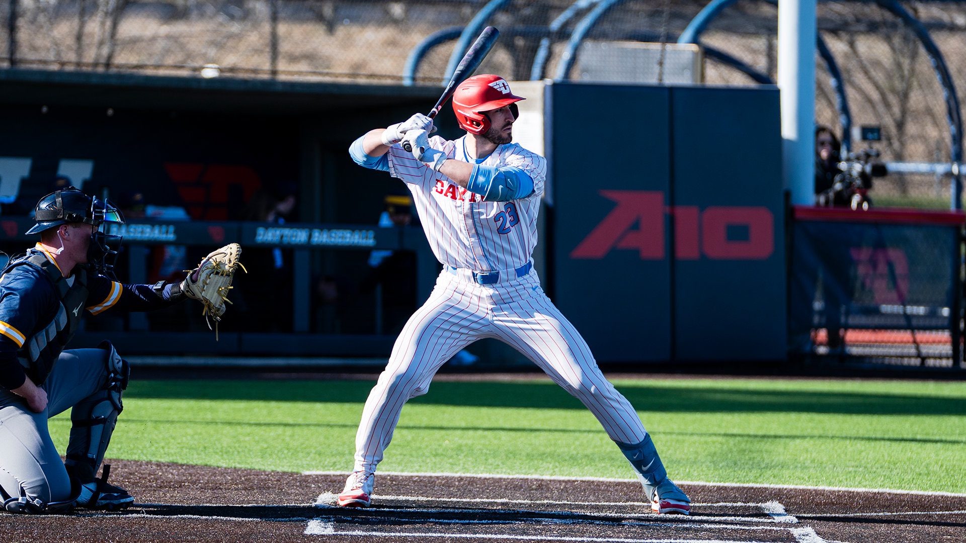 Bobby Stang stands in the right-handed batters box with his bat behind his head, ready for the pitch.