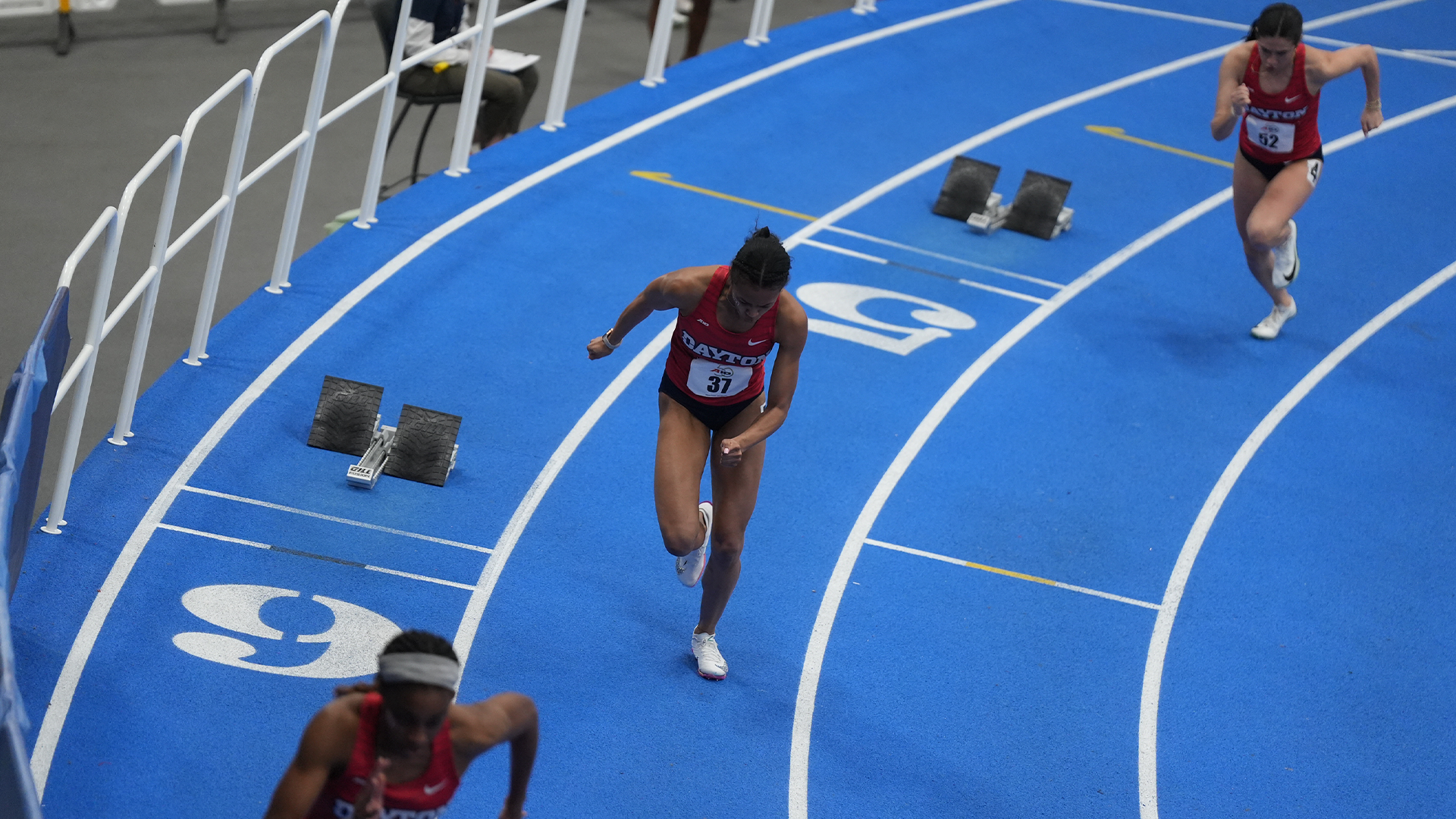 Jadyn Haywood, Simone Bessong, and Sydney Workman take off out of their blocks at the A-10 Indoor Championship