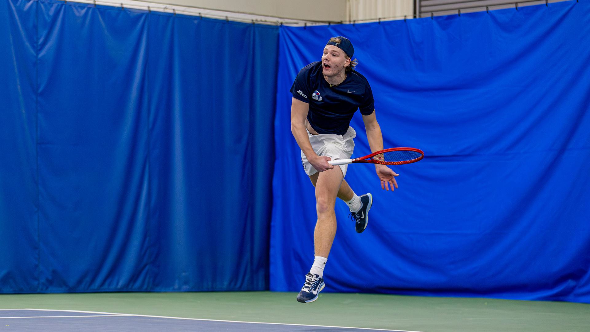 Sturle Skigelstrand is up in the air after serving the ball.
