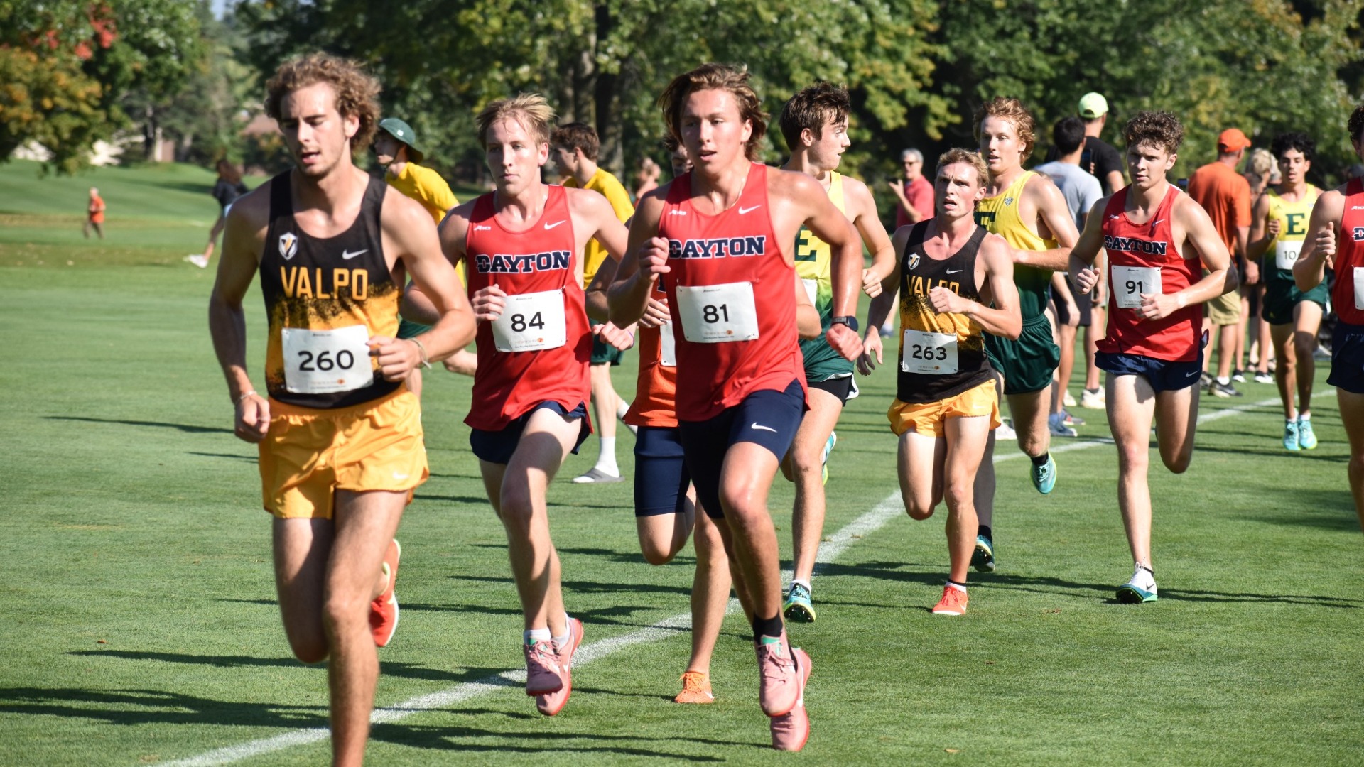 Cross country runners run together in a pack