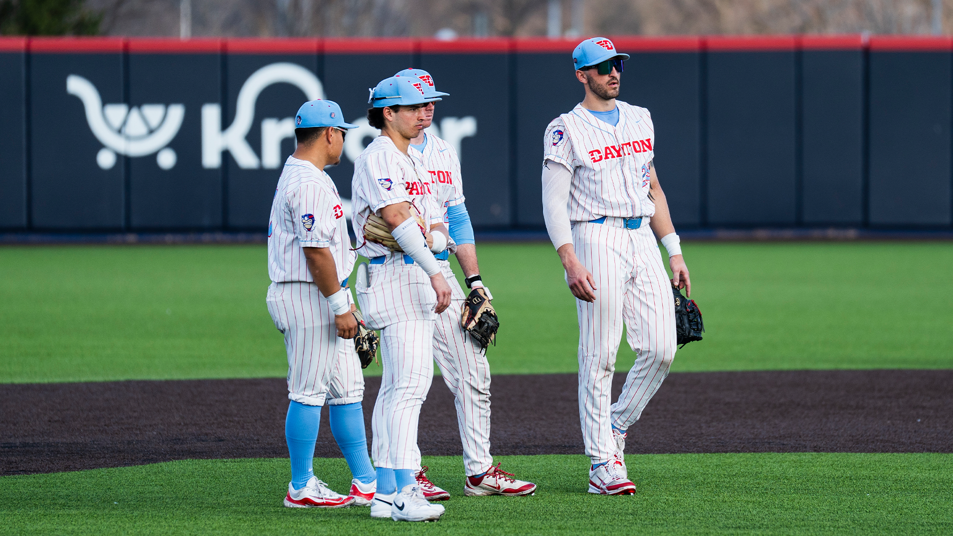 The infielders gather to the right of second base during a pitching change.