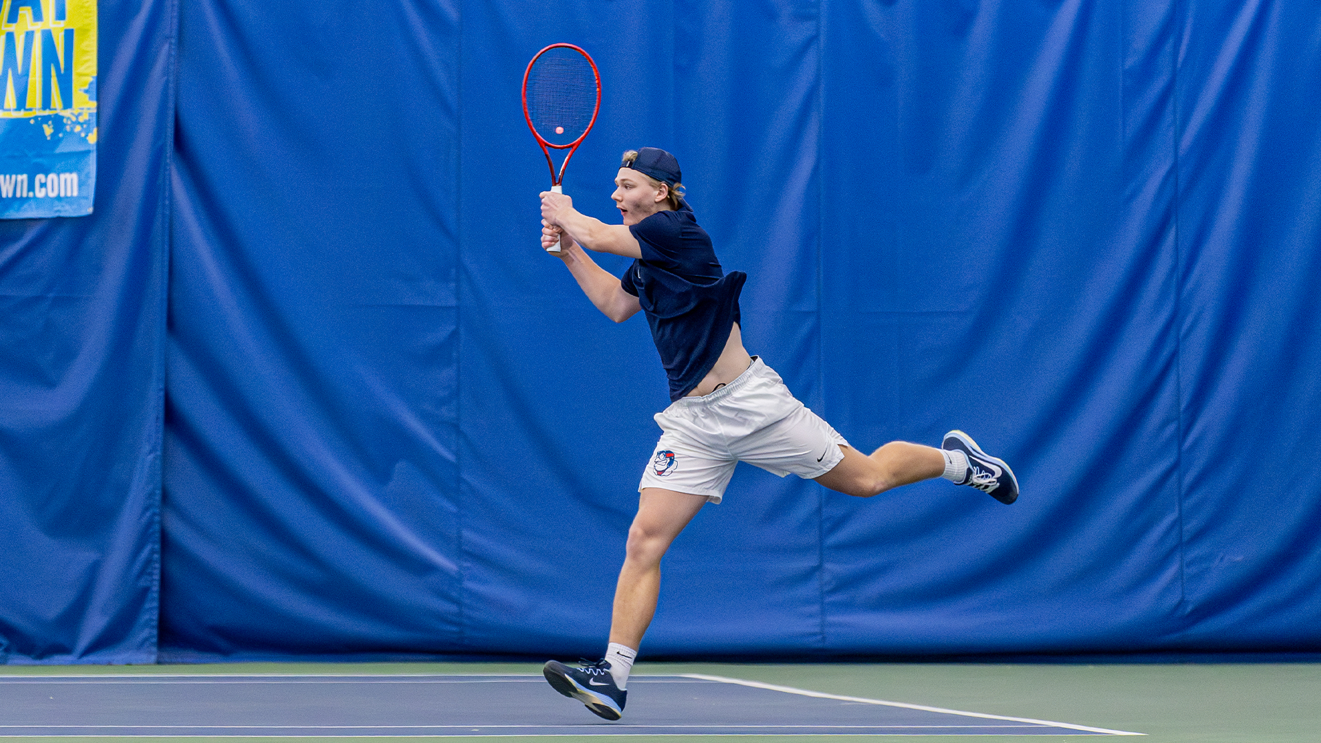 Sturle Skigelstrand leaps into the air to hit the ball.