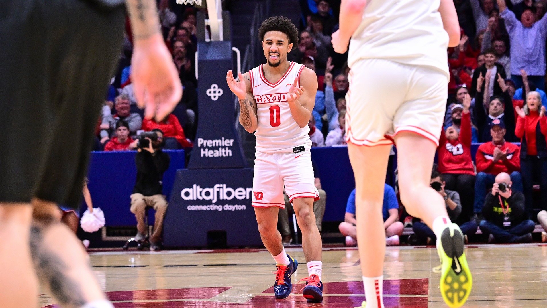 Dayton men's basketball player Javon Bennett celebrates scoring a basket against Saint Louis