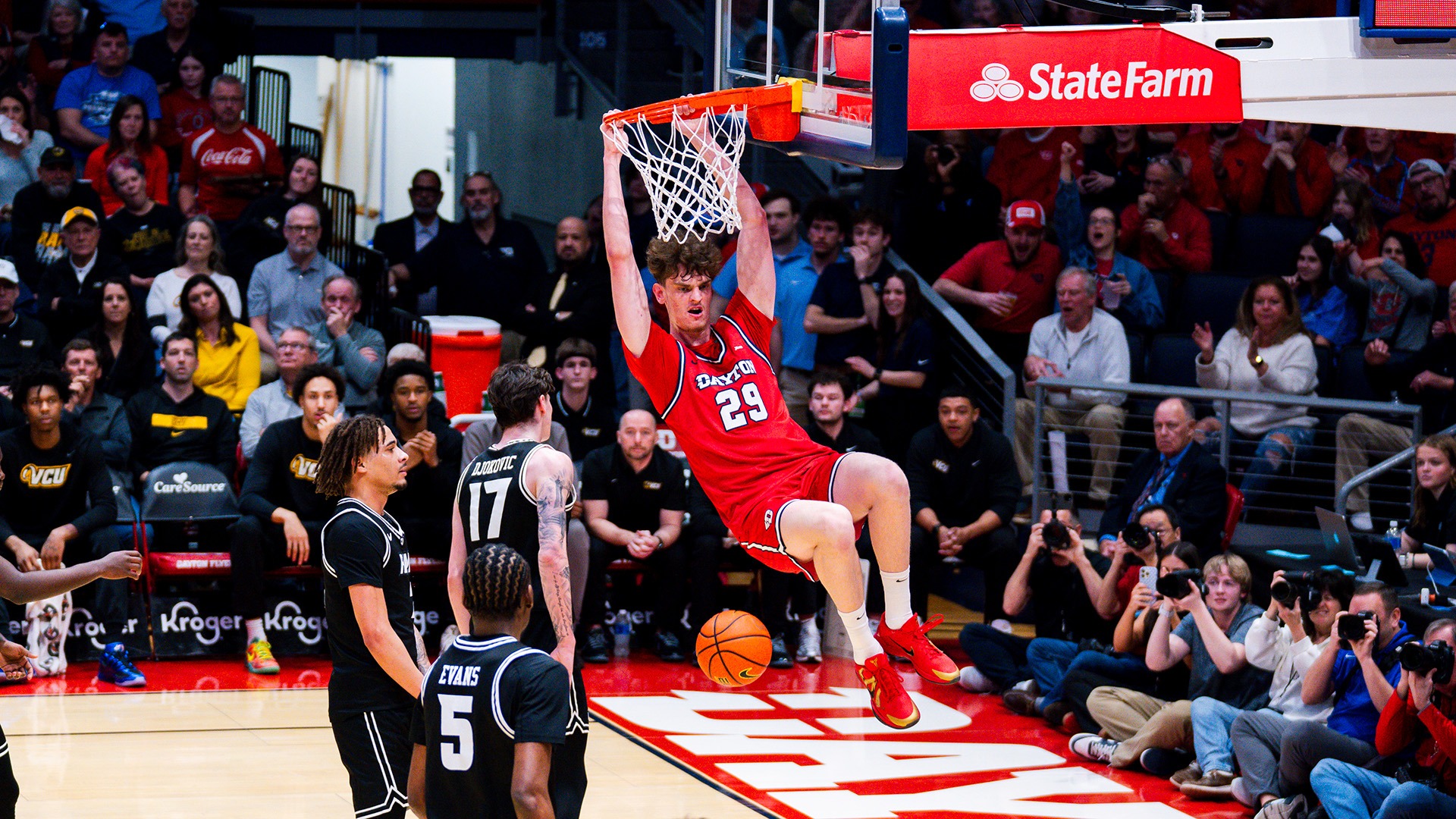 Dayton men's basketball player Amael L'Etang finishes a dunk.