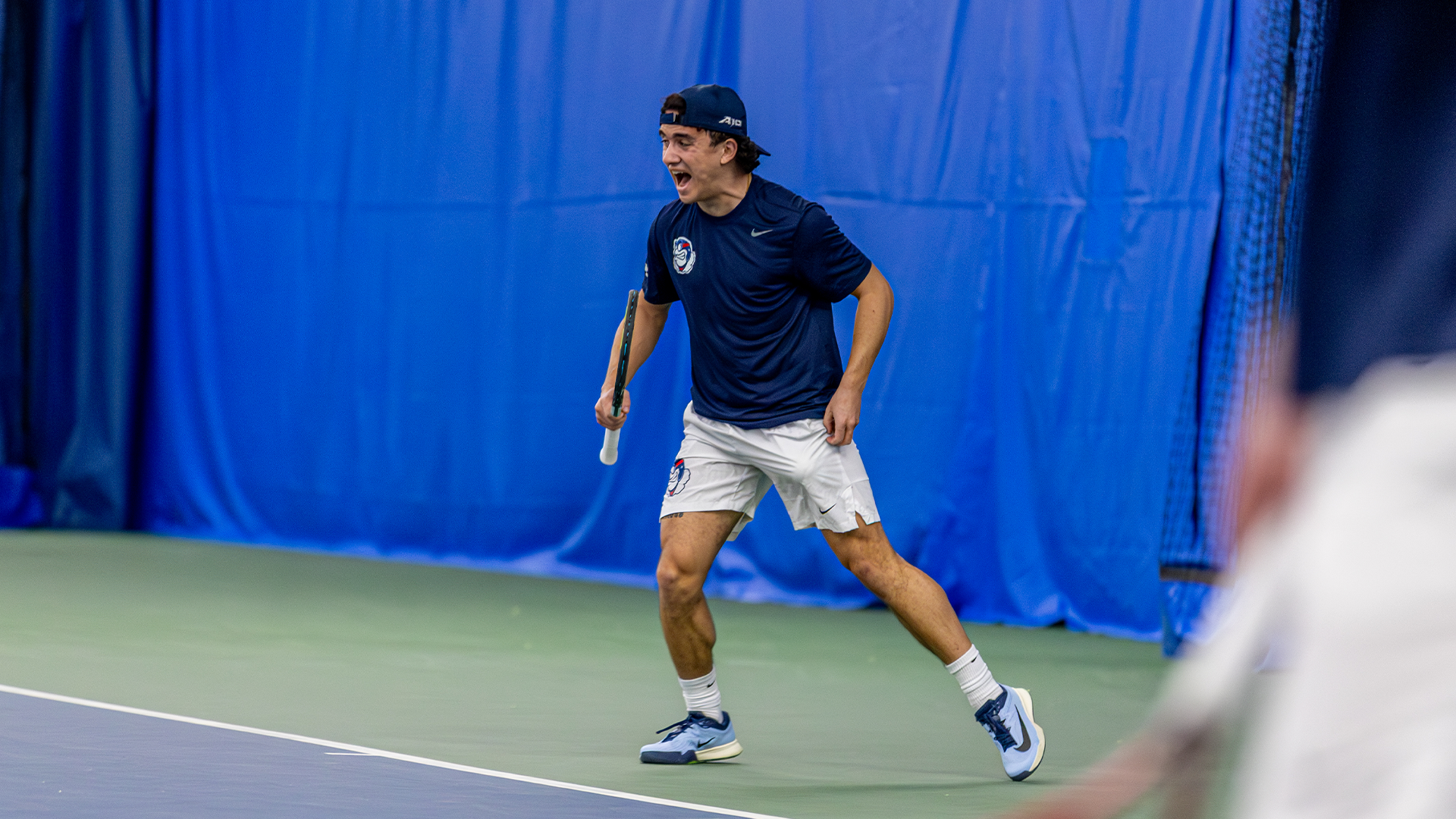 Dylan Jaen yells and pumps his fist after a point.