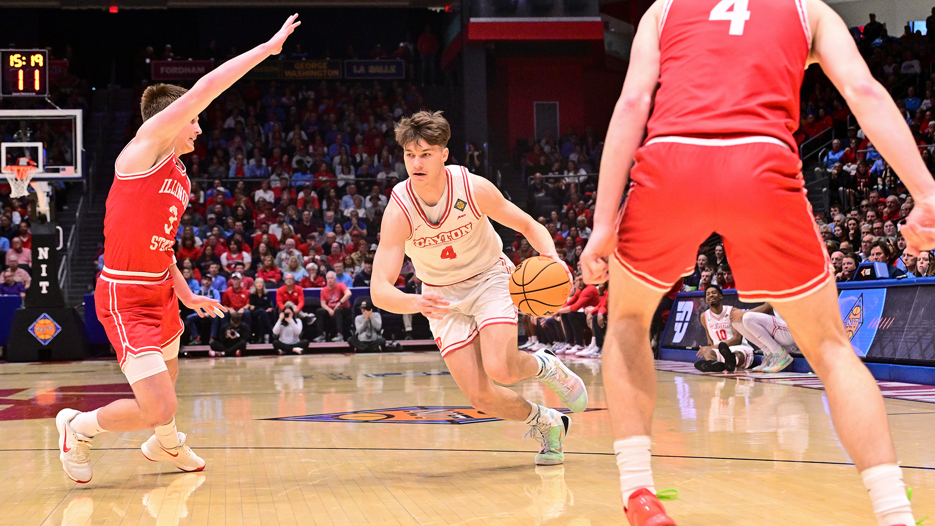 Dayton men's basketball player Jordan Derkack drives against Illinois State in the NIT.
