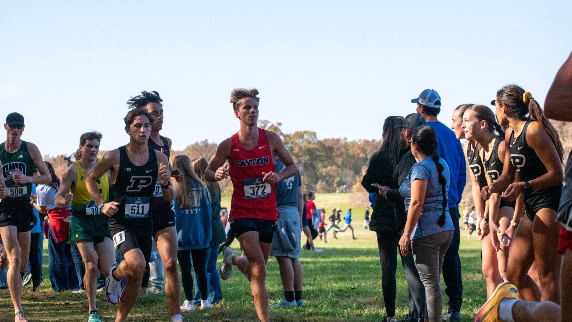 Kamden Kramer runs in a pack of runneers at Great Lakes Regional