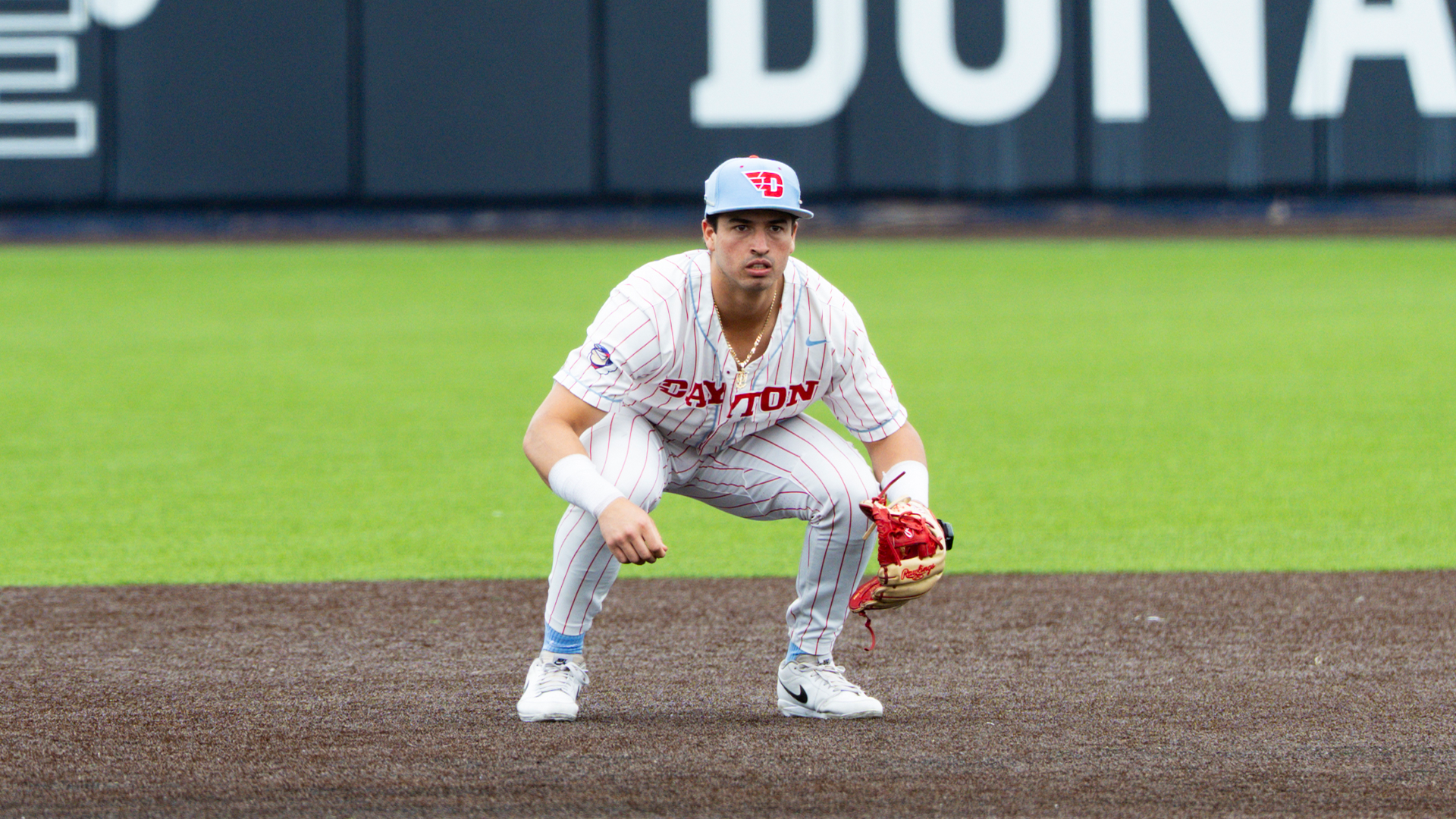 Jason Bello squats down, anticipating a hit.