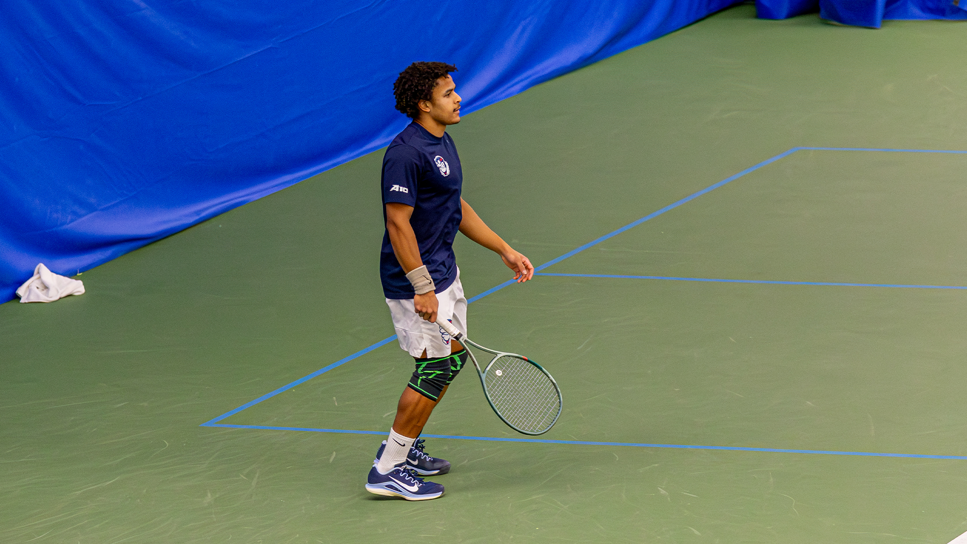 Kaia Mendibe stands in the back of the court, ready to play.