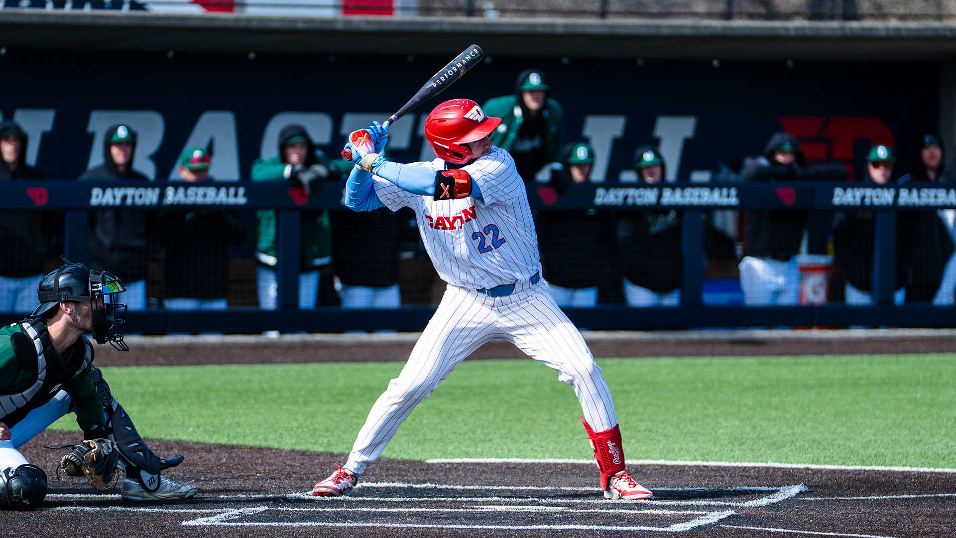 Colin Lynch stands in the right-handed batter's box, ready to swing his bat.