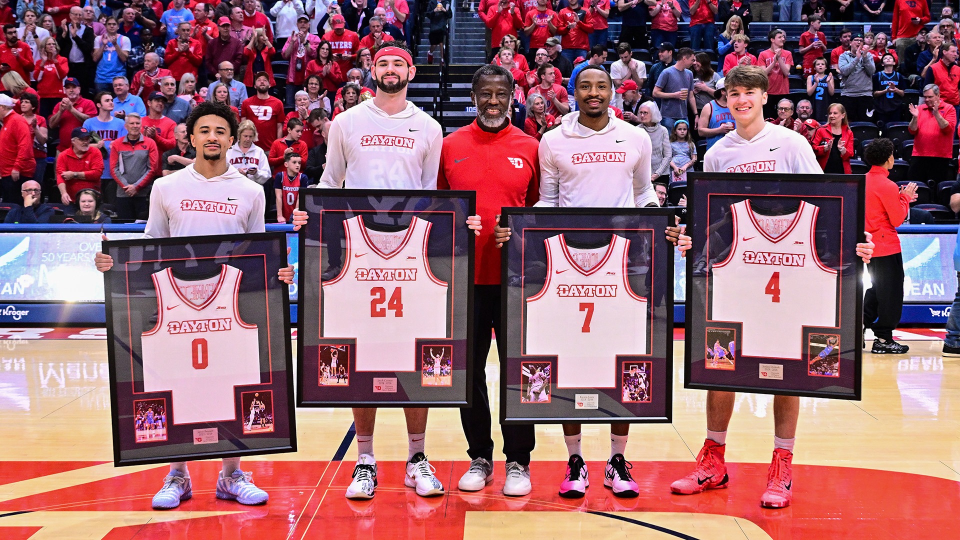 Dayton men's basketball seniors Javon Bennett, Jacob Conner, head coach Anthony Grant, Keonte Jones and Jordan Derkack smile for a photo prior to the senior night game against VCU.