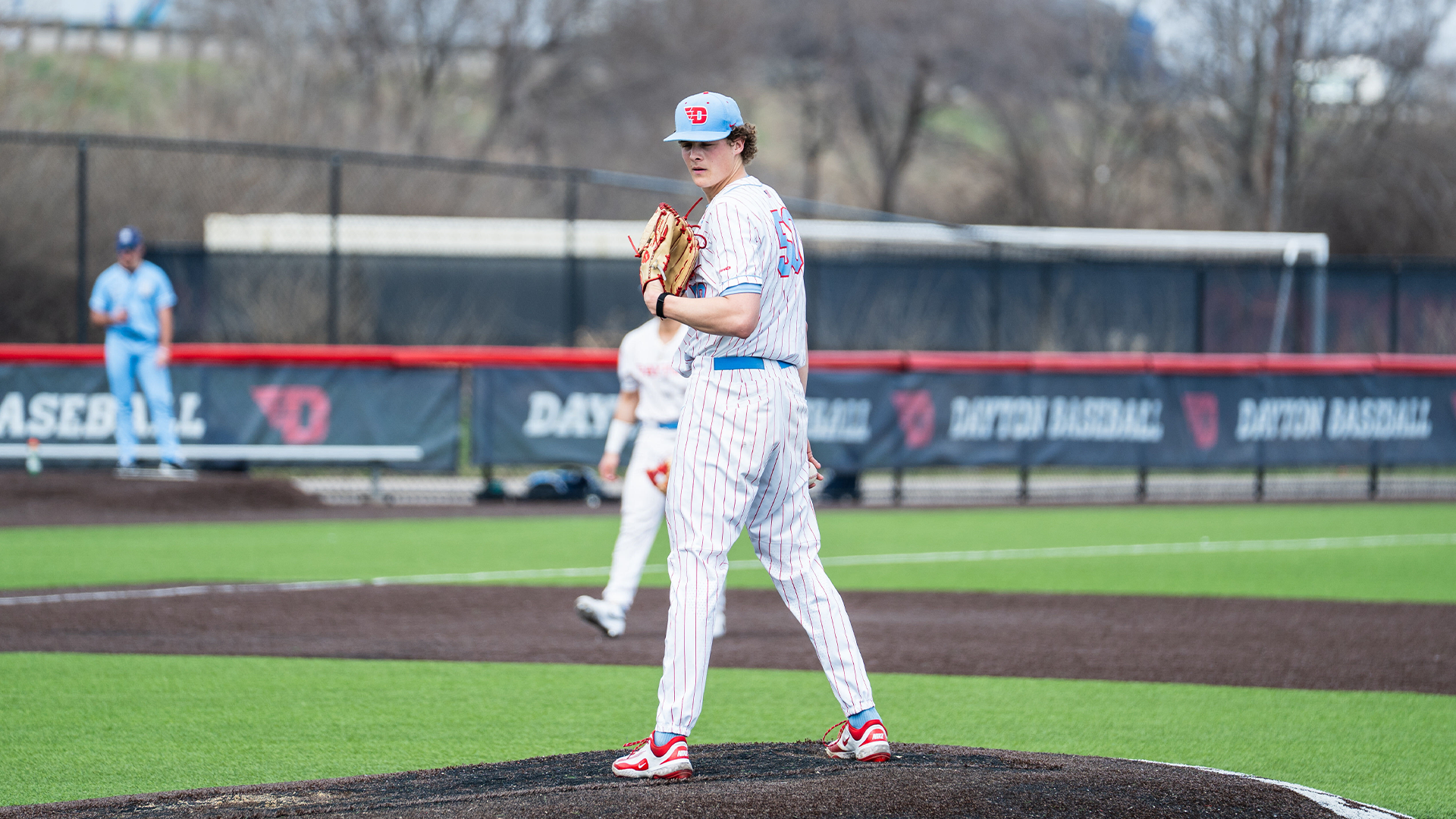 Sawyer Jensen looks to the dugout before throwing a pitch.