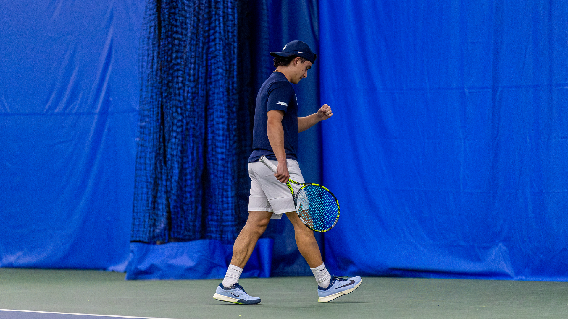 Dylan Jaen pumps his left fist in excitement after a point.
