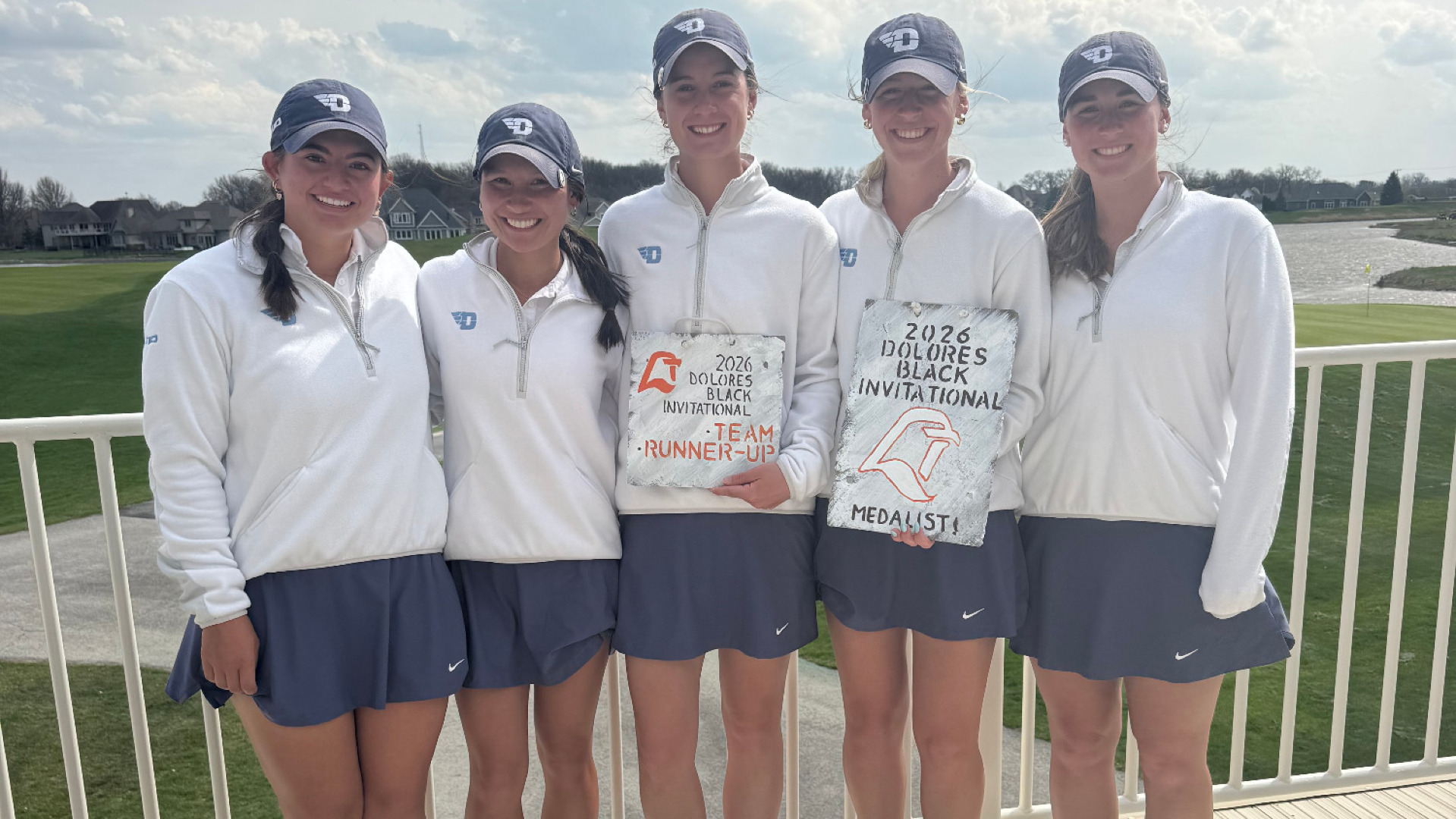 Five members of the women's golf team pose together following the Dolores Black Falcon Invitational holding the second-place team award and the individual medalist award