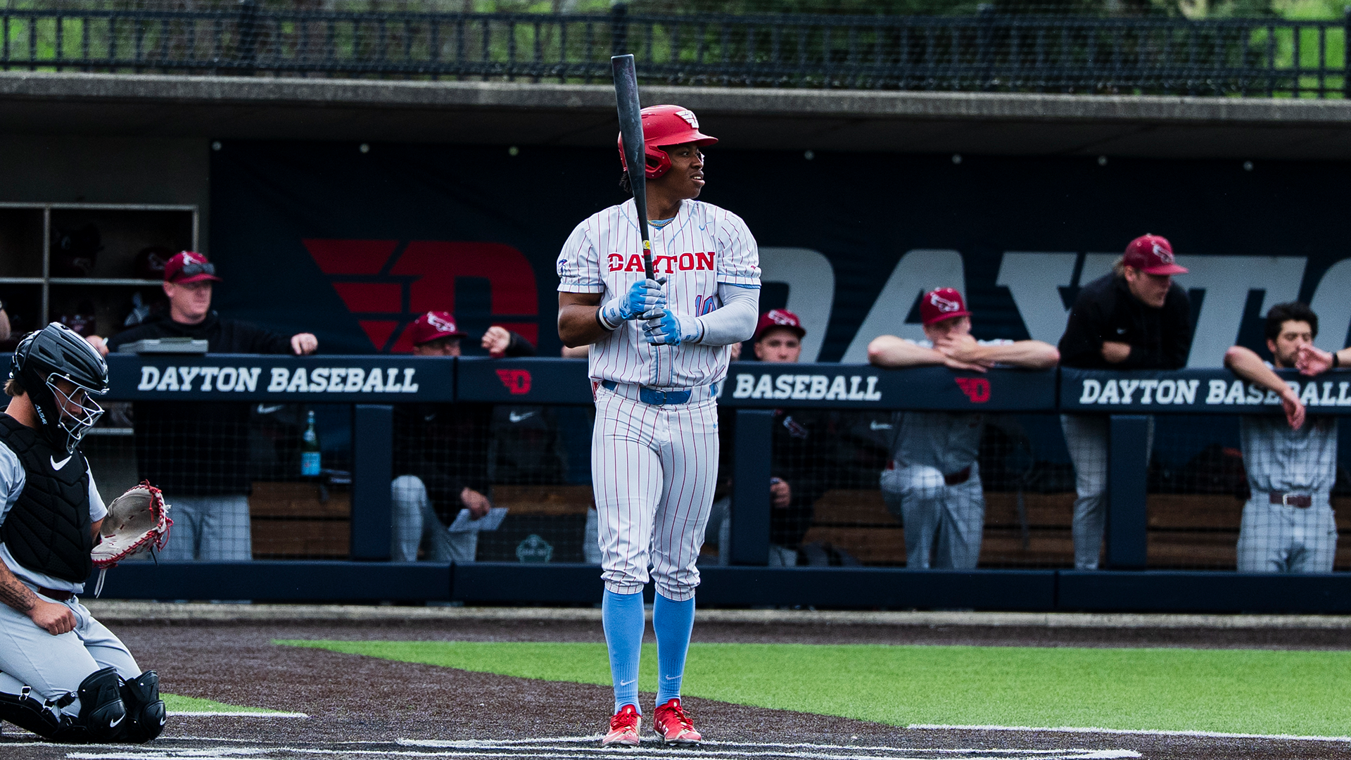 Michael Smith Jr. holds up his bat in front of him as he enters the batter's box.