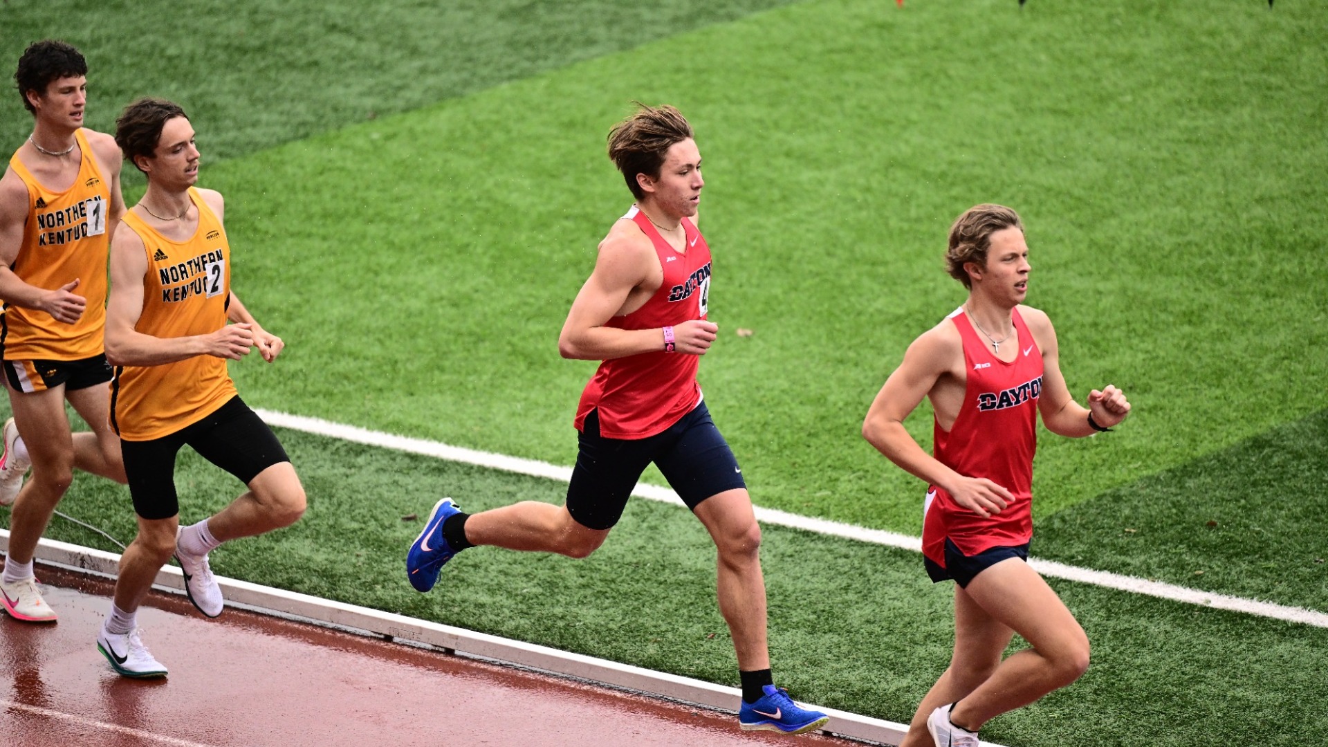 Gerrit Dam and Jacob Finney run side by side on the track