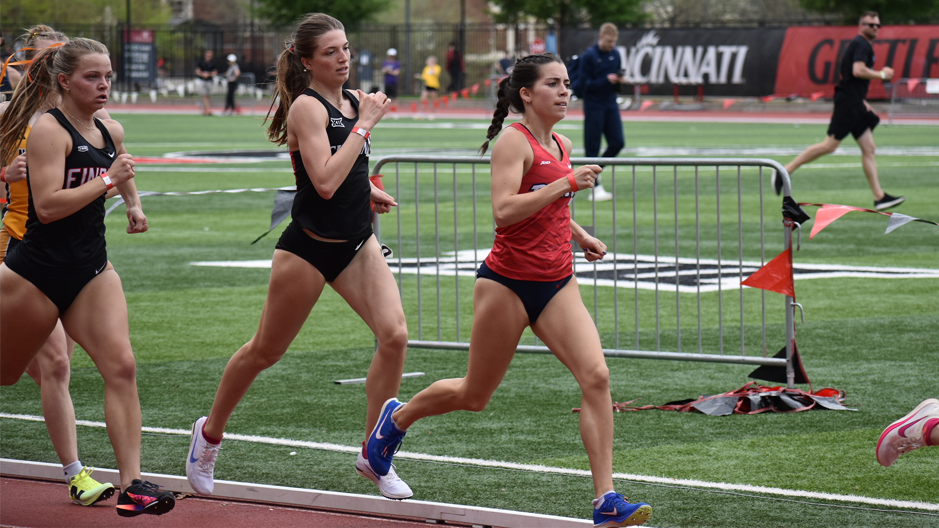 Mia Gill runs ahead of a pack