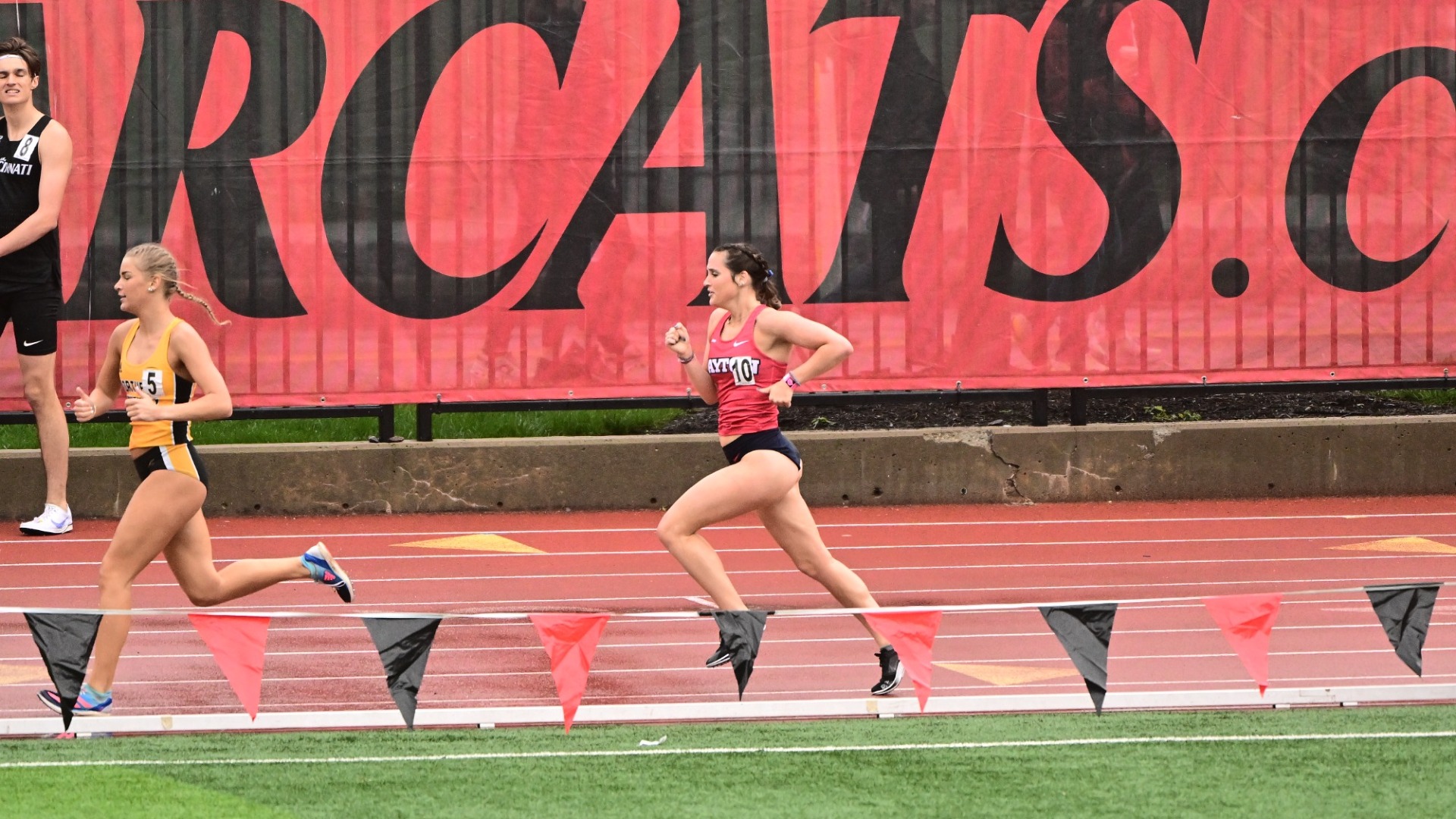 Anna Newkirk runs around the bend behind another runner at Cincinnati