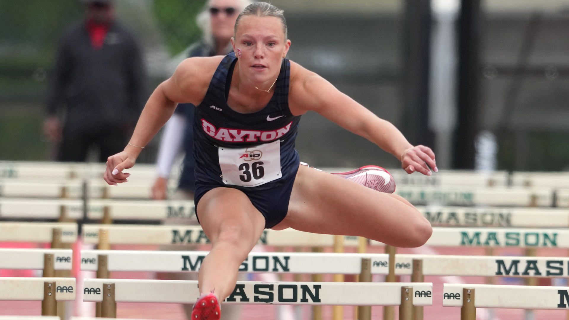 Raegan Ernst leaps over a hurdle at the A-10 Outdoor Championships